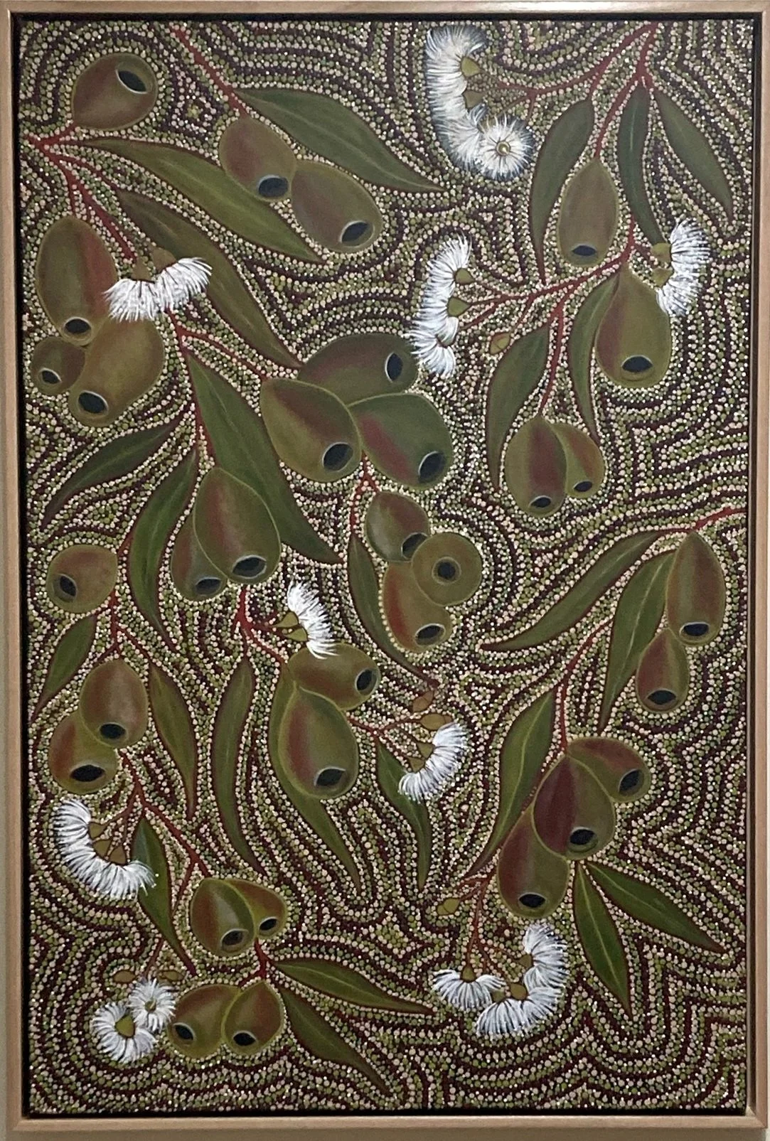 Painted artwork depicting a pattern of green and brown leaves, white caterpillars, and dotted background with small white and yellow circles.
