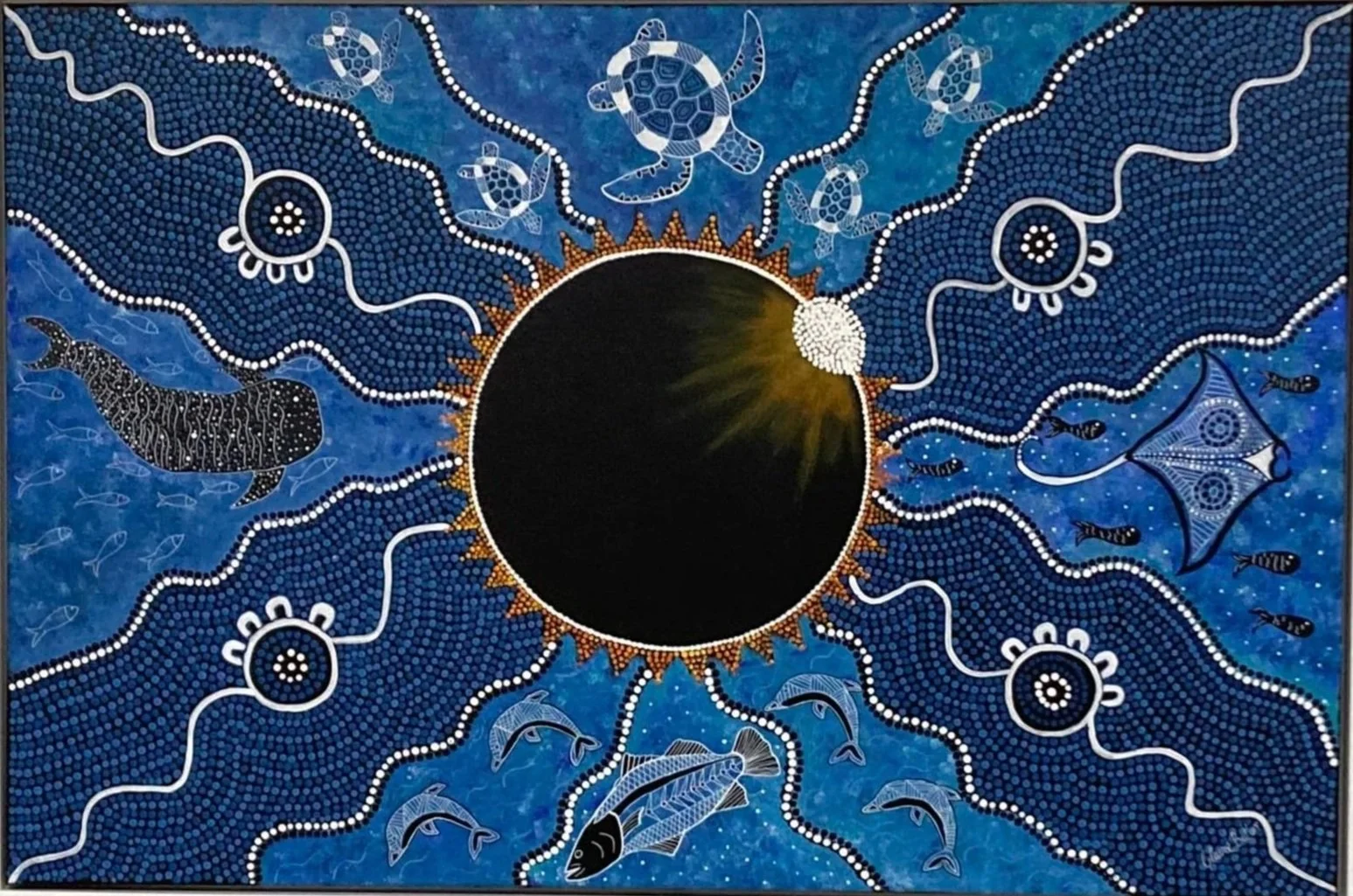 An Aboriginal art painting depicting a solar eclipse with a dark circle at the center, surrounded by a golden sunburst. Blue patterned background with white dotted lines, turtles, and various fish, including a large whale and a stingray.
