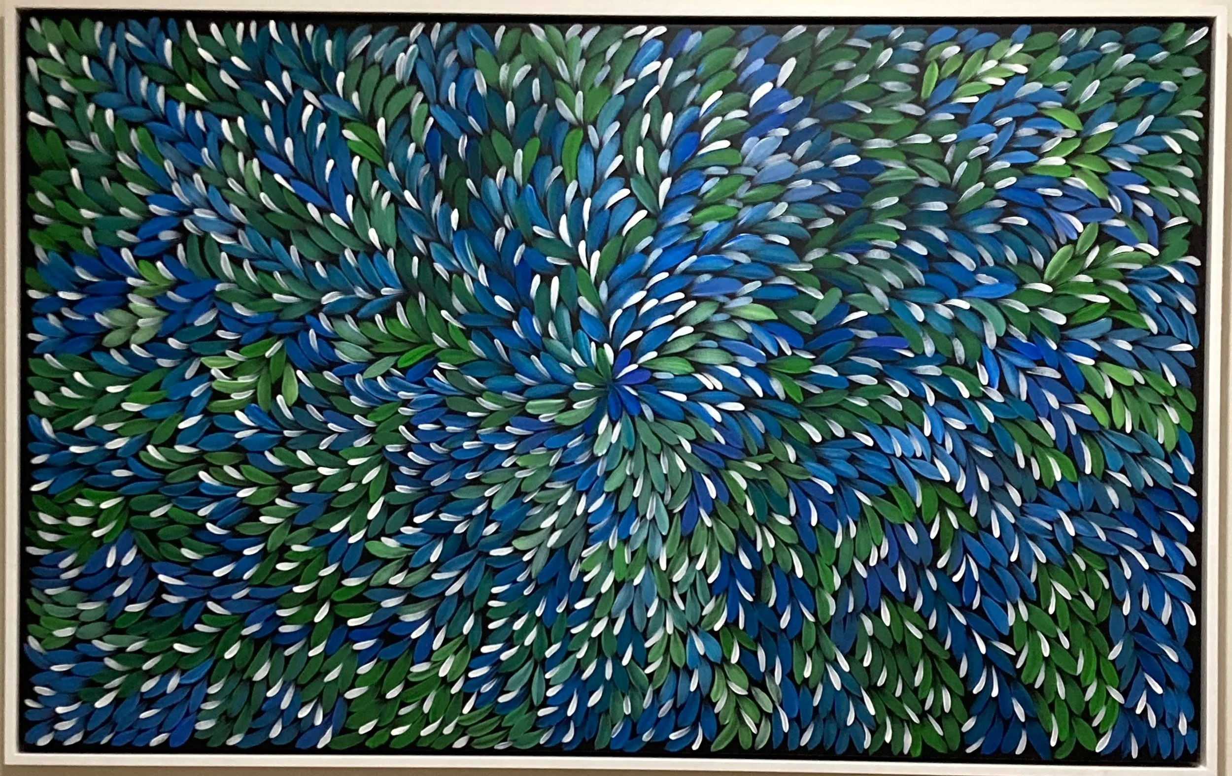 Colorful abstract artwork featuring vibrant flowers and leaves in shades of blue, green, red, and orange, with intricate dot patterns and swirling designs.