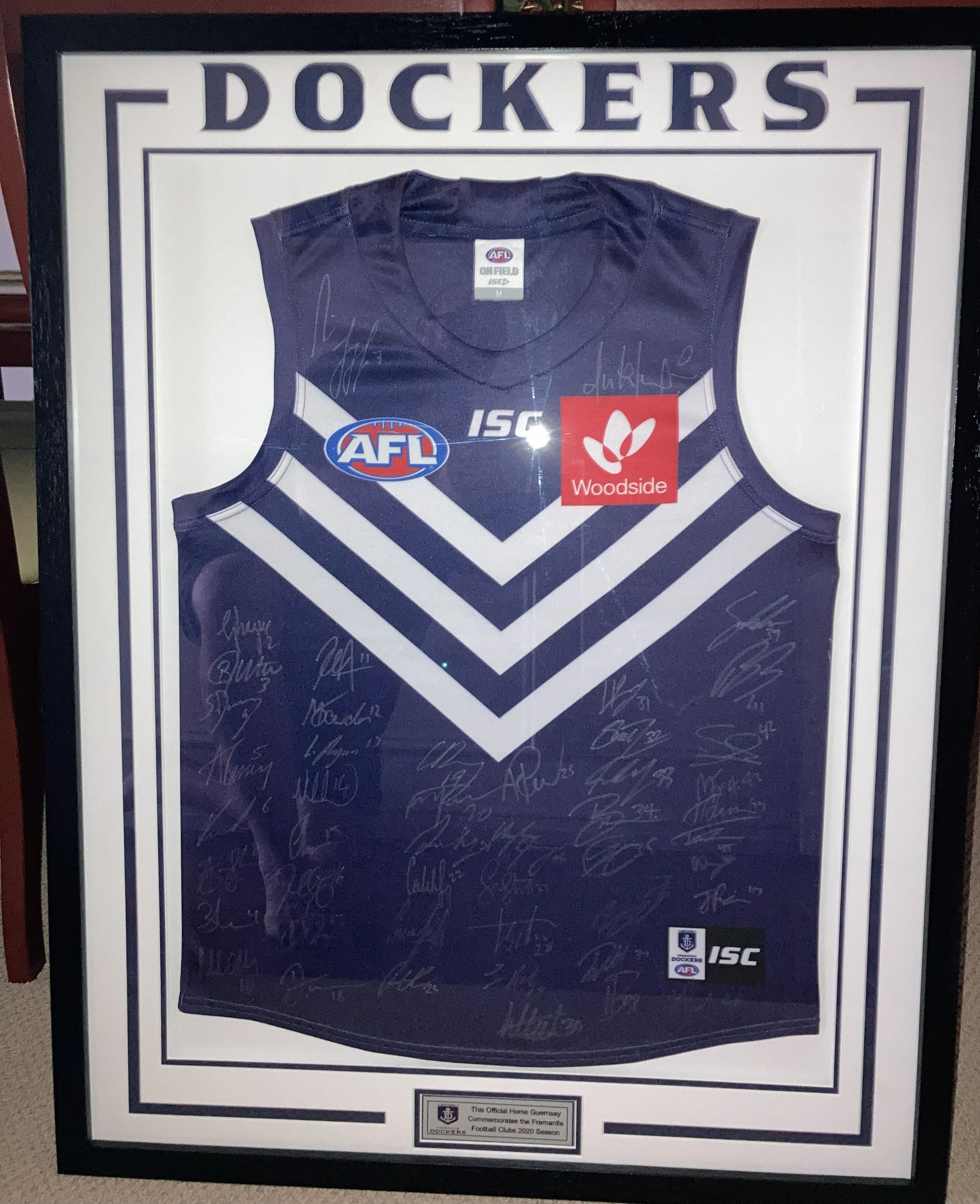Framed sports jersey with the name Cork and number 30, featuring Coca-Cola sponsorship patches on sleeves.