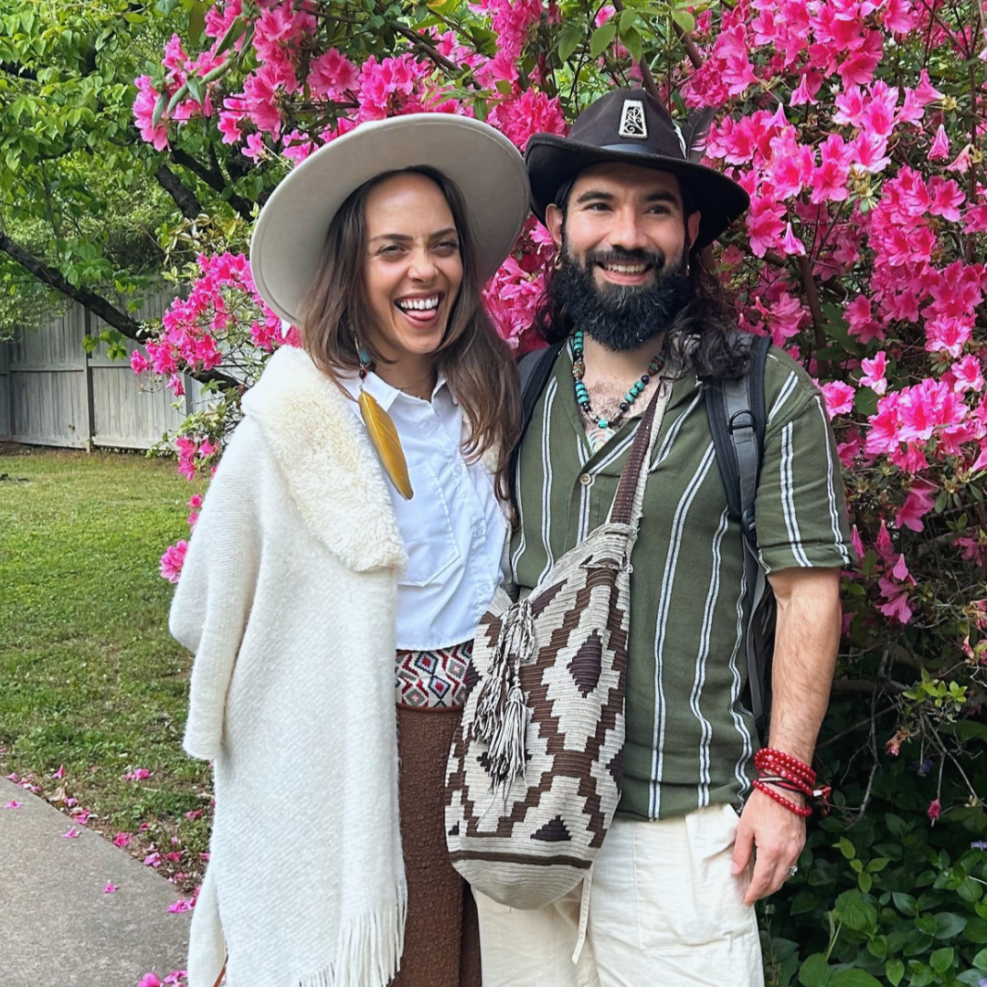 miguel amaru and reina g in front of flowering tree