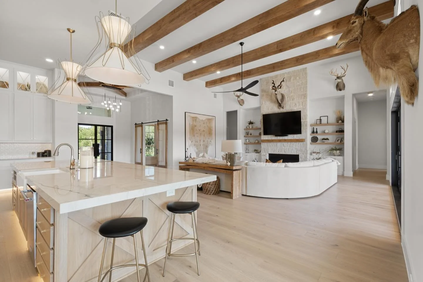 I love when clients have a big wall ready for custom art. In this home we used a custom cowhide and mounted it on a custom stretched canvas frame. The hide includes local registered brands from a small community in Texas! What a show stopper and conv