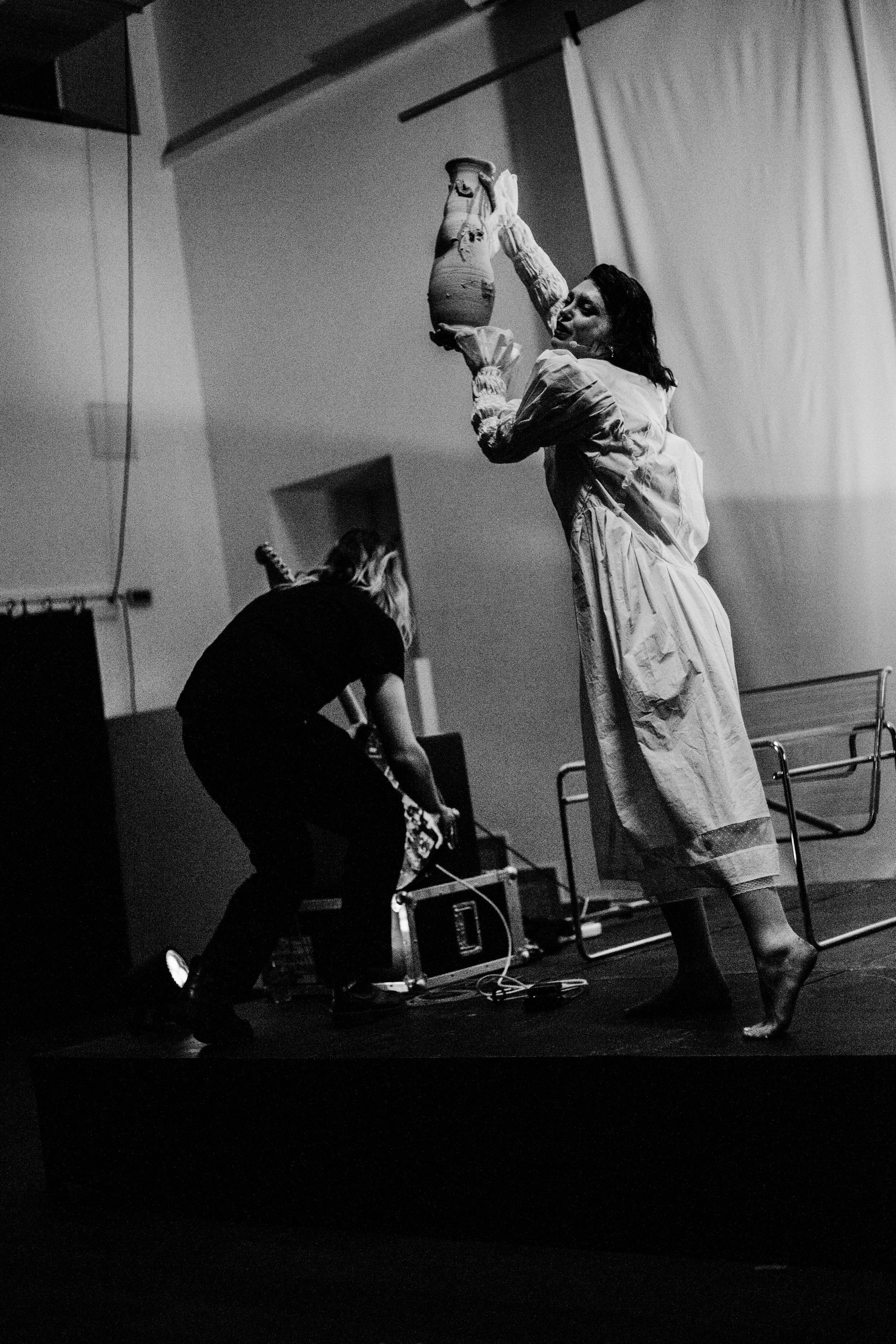 Black and white photo of  the actress Valeriia Karaman & Julien Sitruk performing a political performance at Not Allowed aka @notallowedshows 