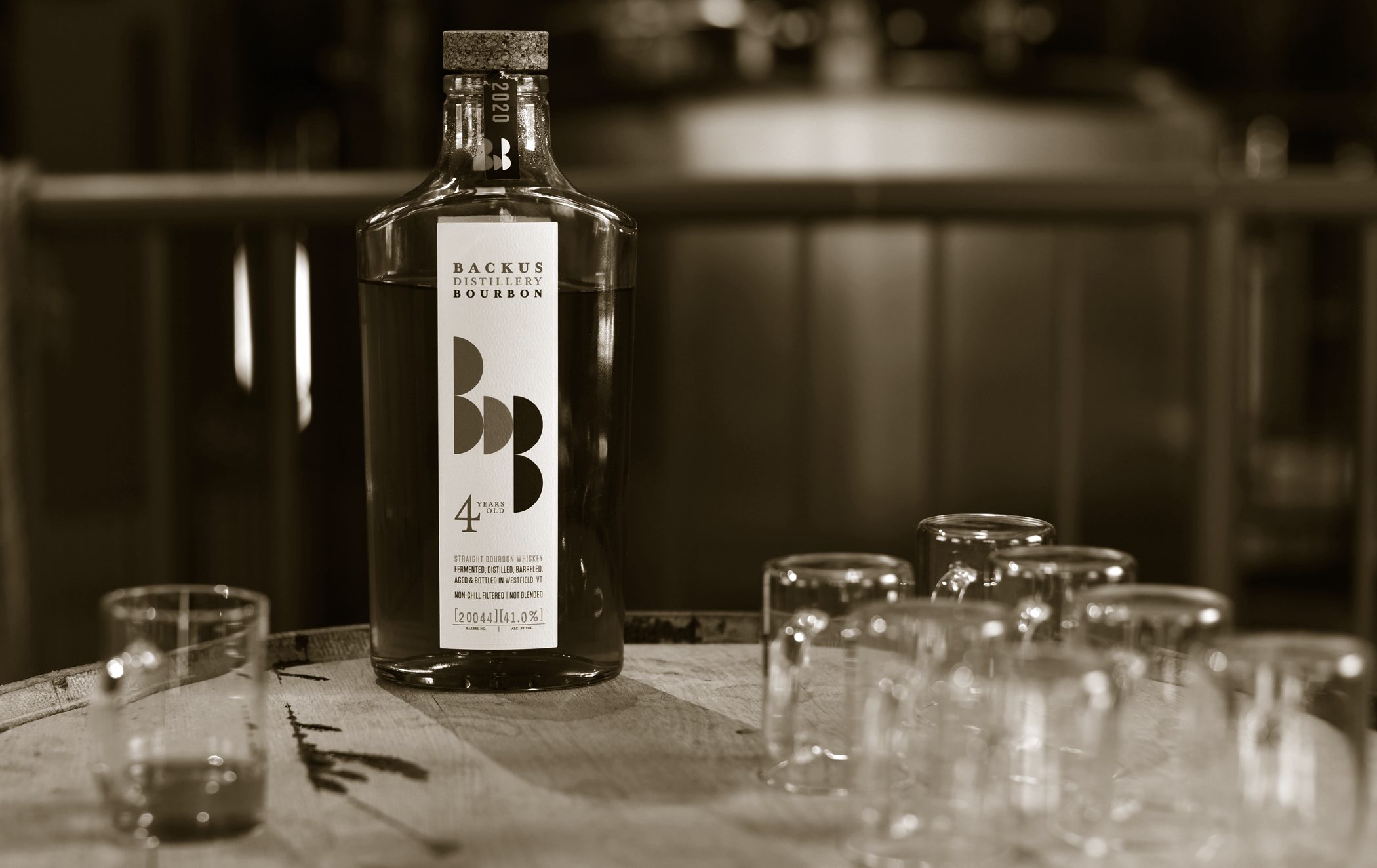 backus-distillery-bottle-glass-duo.png