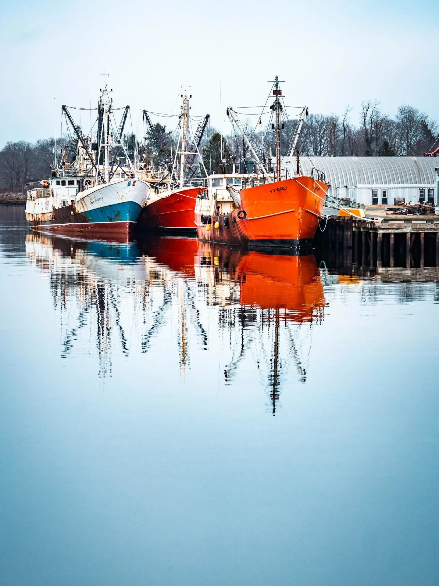 In a shocking turn of events, this post is not about SEO or websites. Welcome to Liverpool, NS, the place I am delighted to call home!

Last week I took myself on a photowalk with the long lens and enjoyed the heck out of reflections of fishing boats