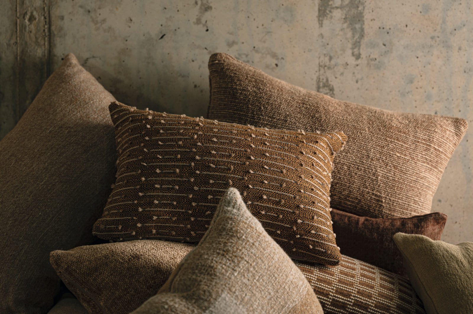 Close-up of Élitis textile surface highlighting weave, texture and material depth in contemporary fabric design