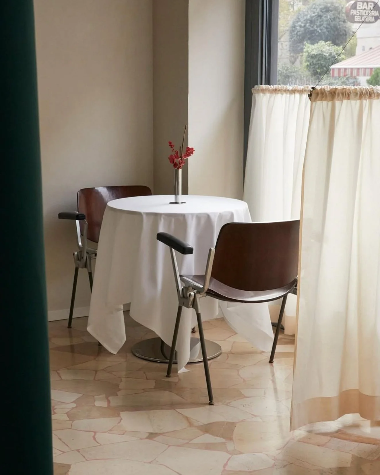 Refined dining room interior at Sandì restaurant, Milan