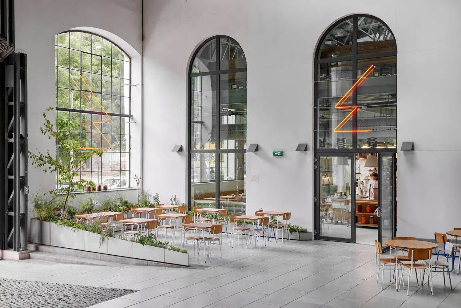 Eska restaurant in Prague with open kitchen, wooden interiors and industrial design