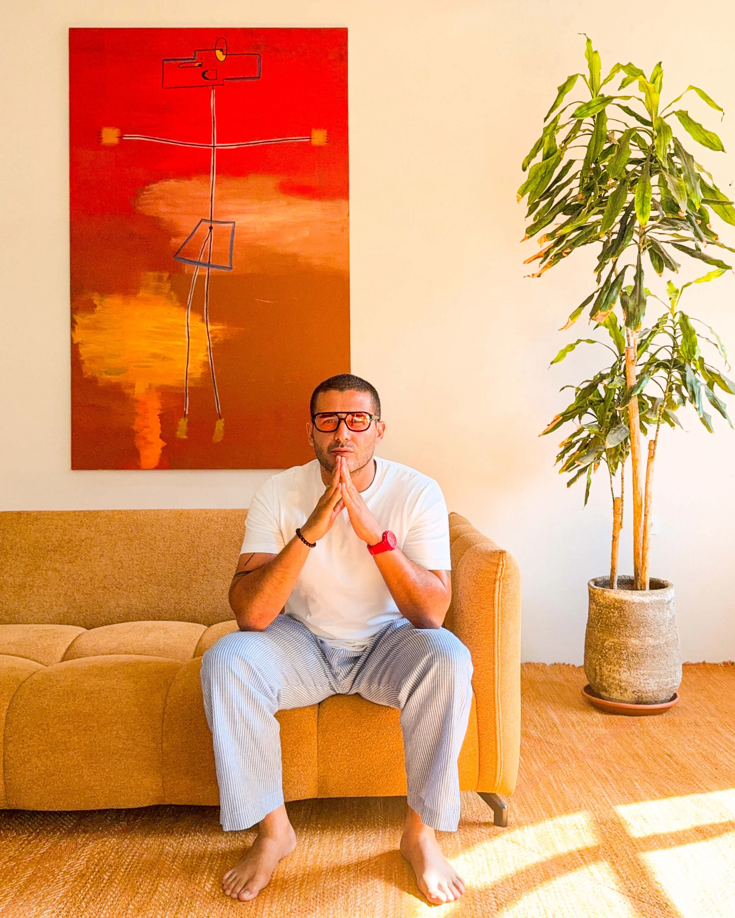 Portrait of NICH in his studio surrounded by materials.