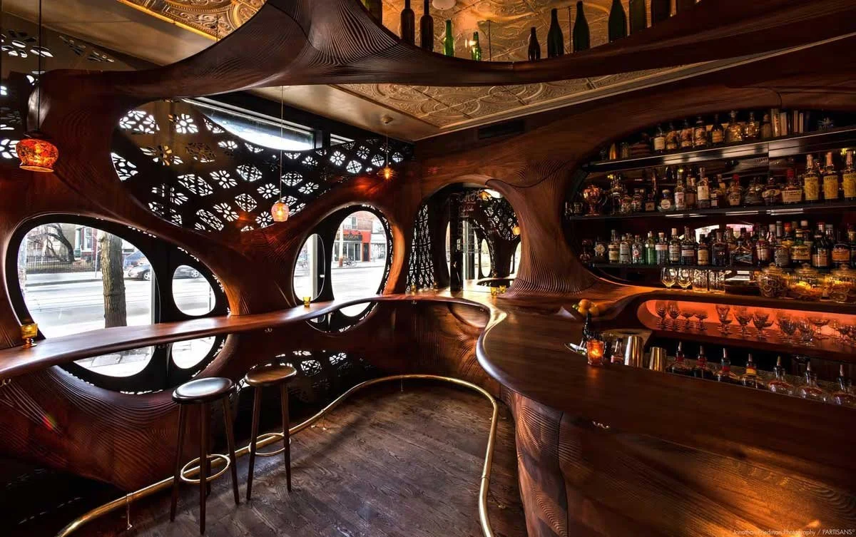 Bar Raval sculptural wooden interior by Partisans