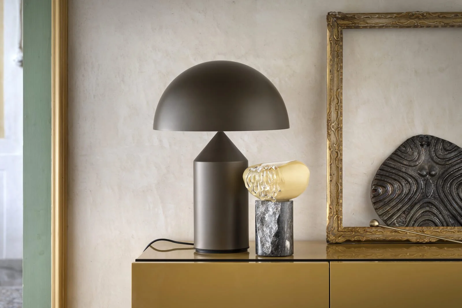 Decorative lighting object by Aina Kari blending glass and marble