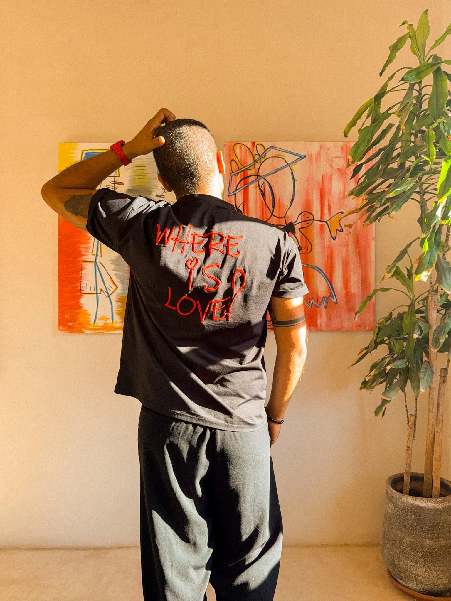 Portrait of NICH in his studio surrounded by materials.