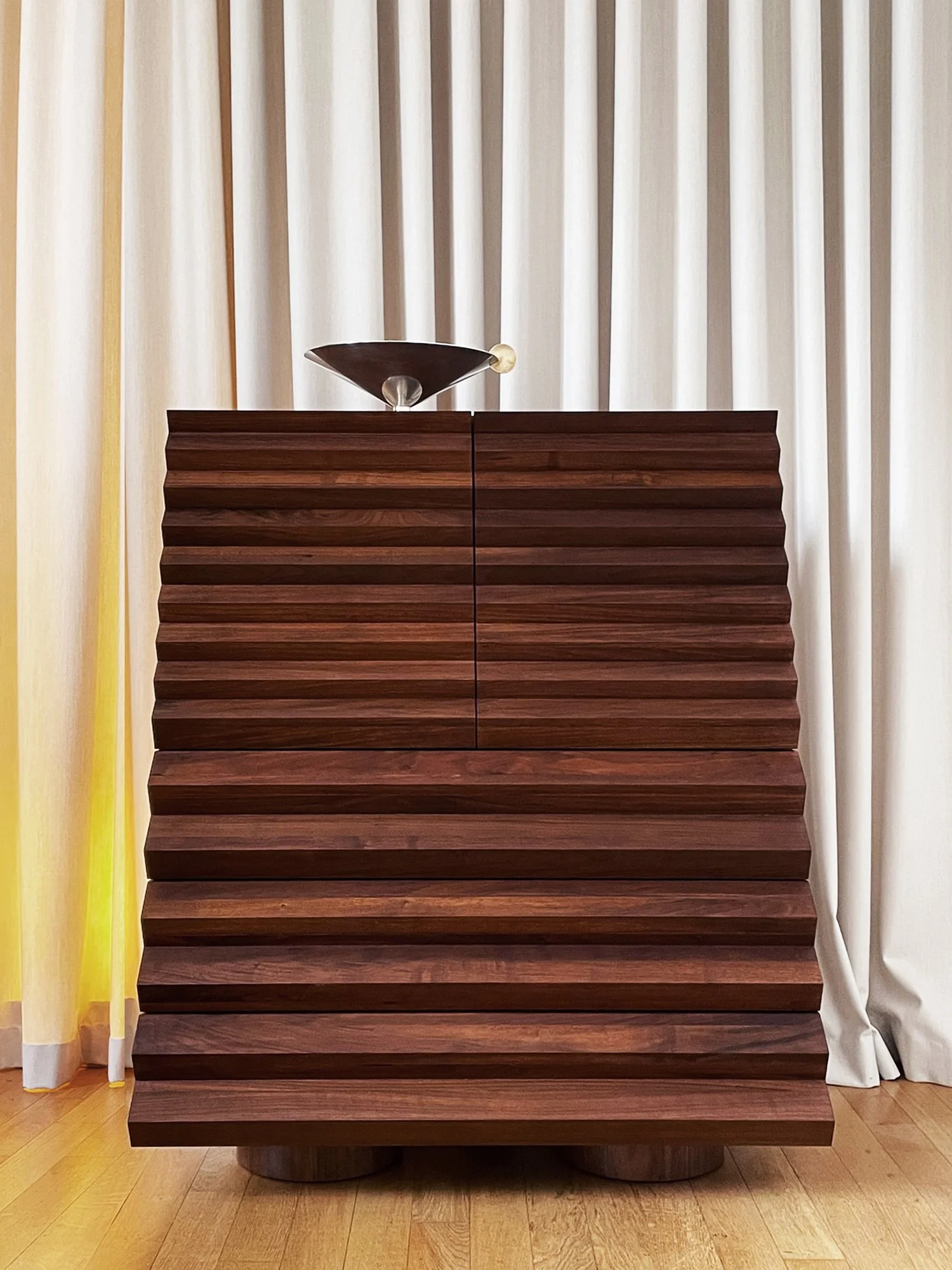 Limited-edition collectible design furniture displayed in Kolkhoze gallery Paris with sculptural forms and material detail