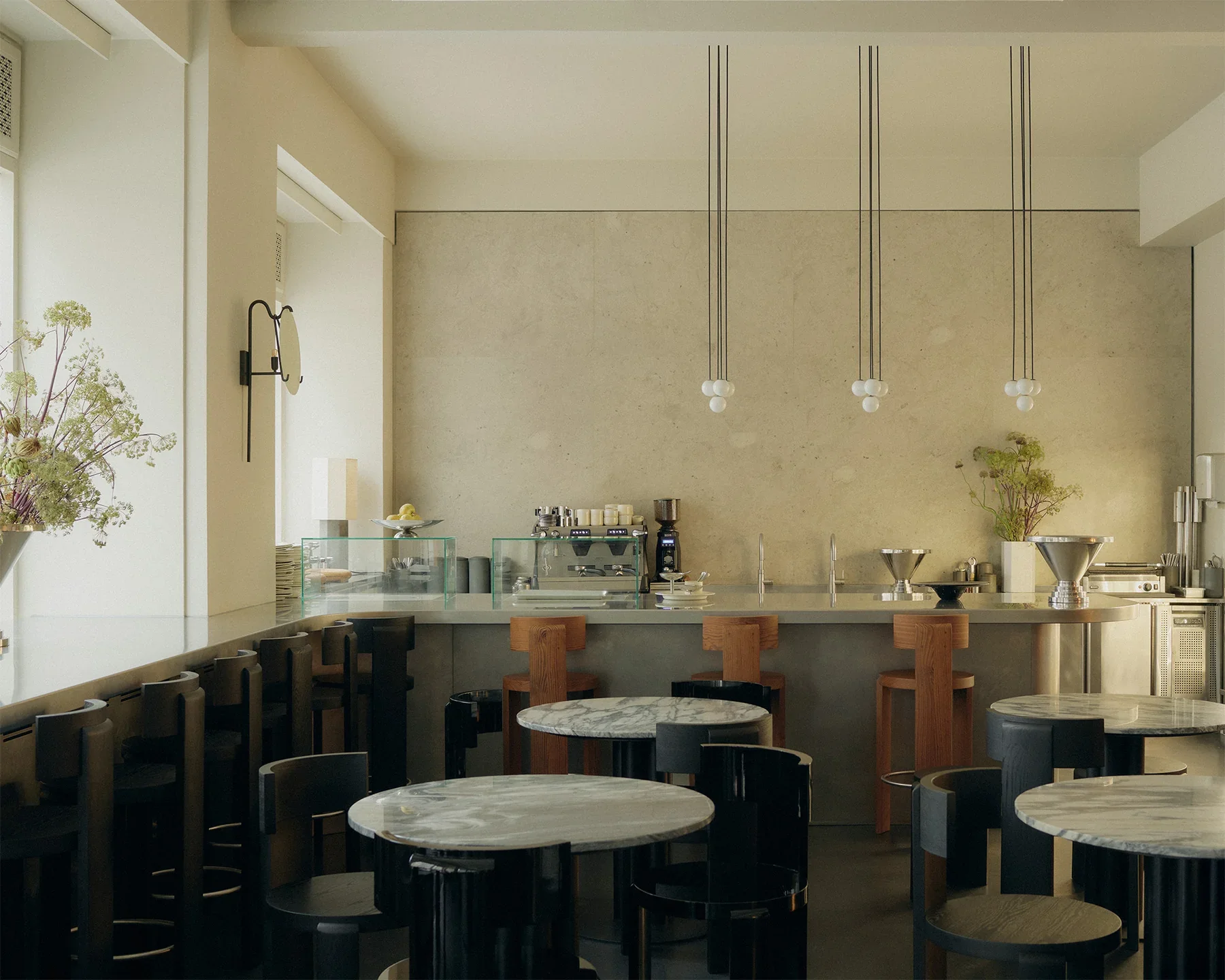 Minimalist café interior with natural light and warm materials