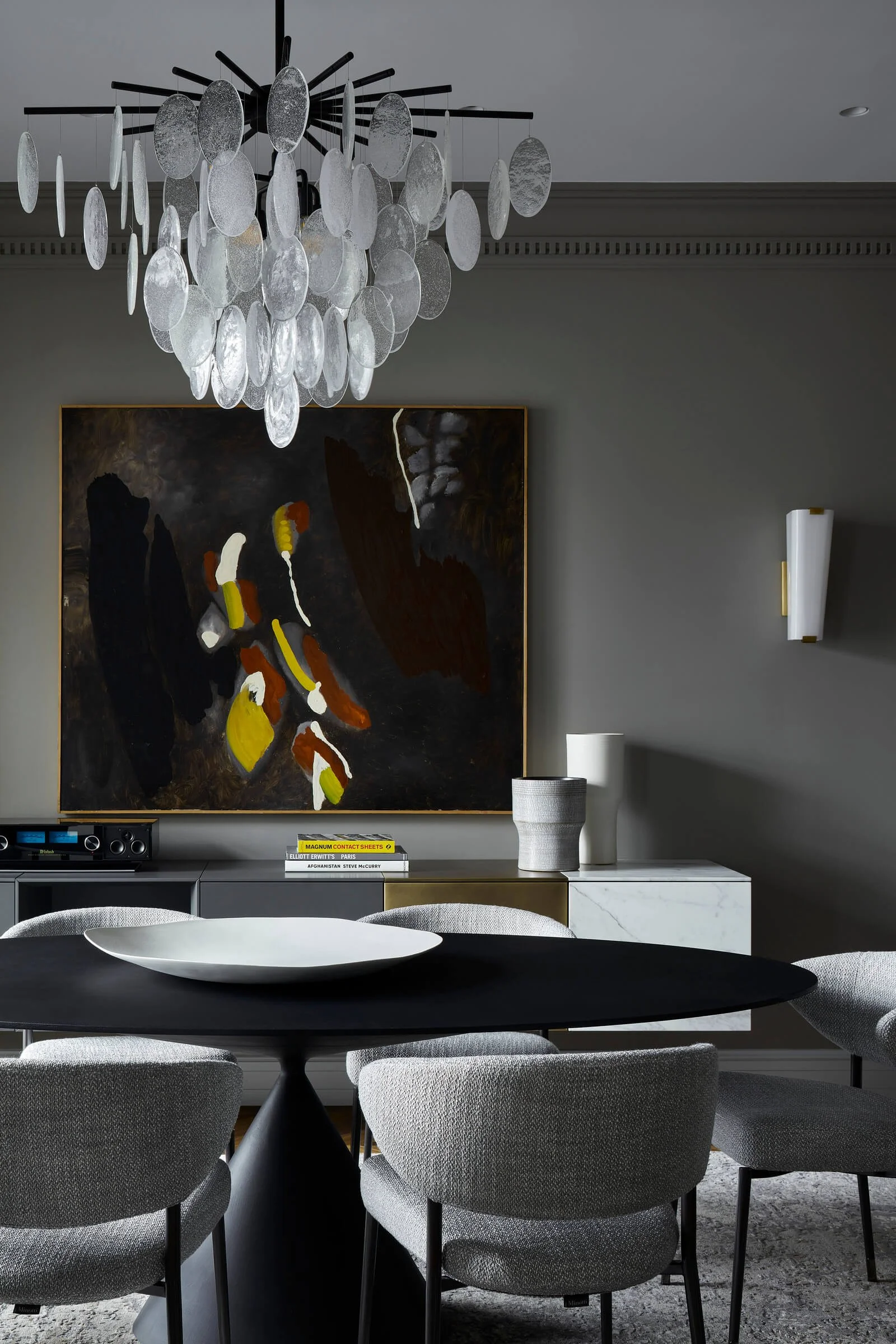 Interior with curated contemporary art and sculptural furniture