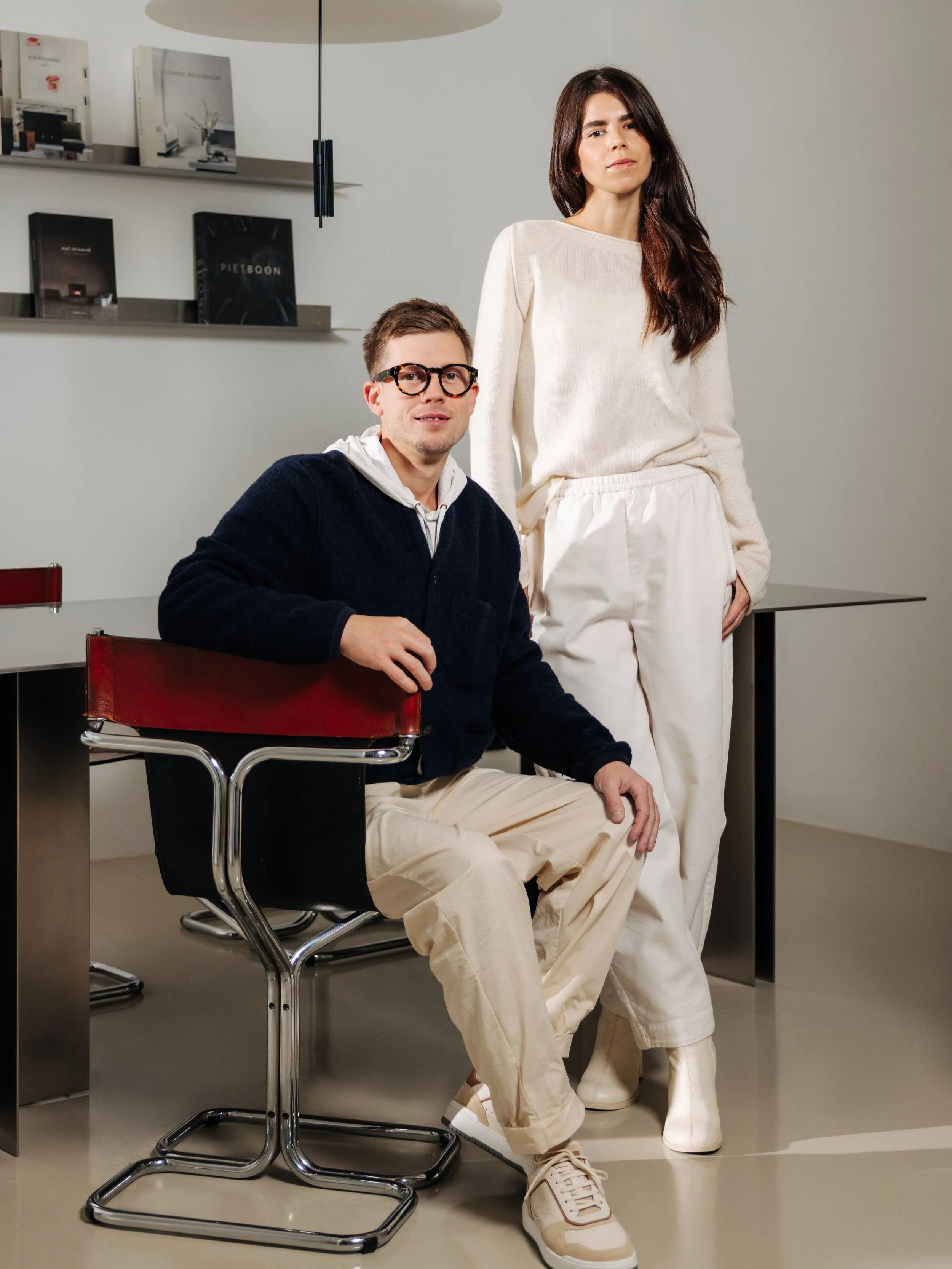 Portrait of Rhyme Studio founders in a modern office setting.