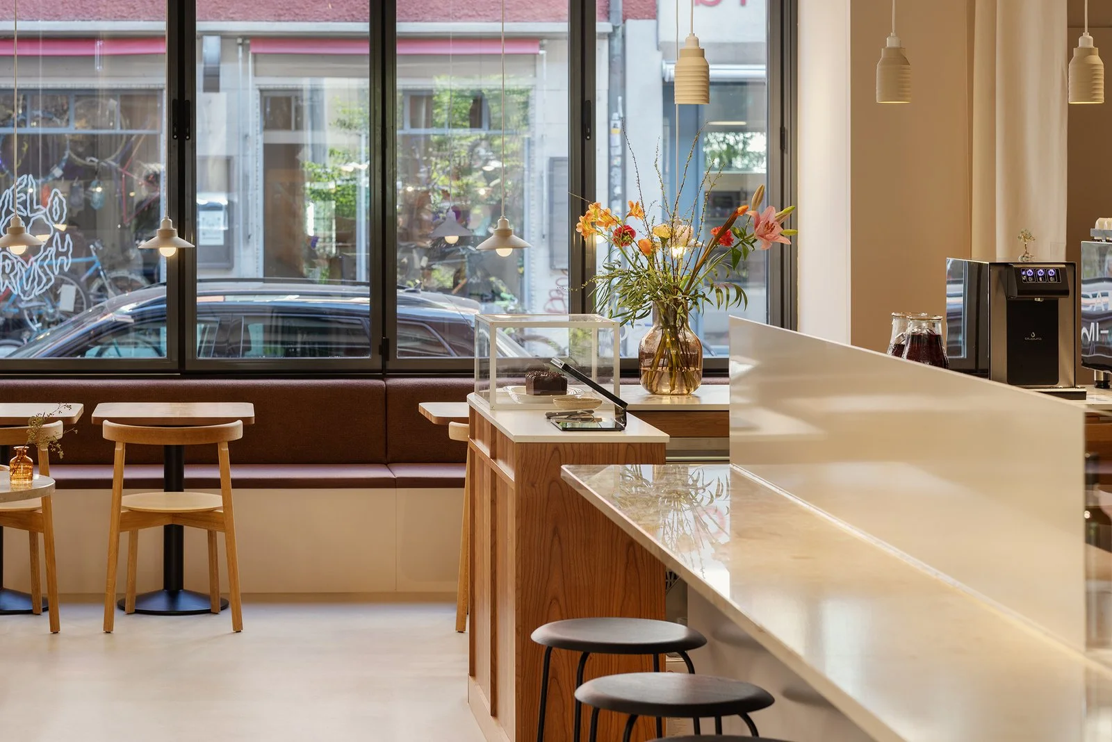Light-filled café space with neutral palette and open layout