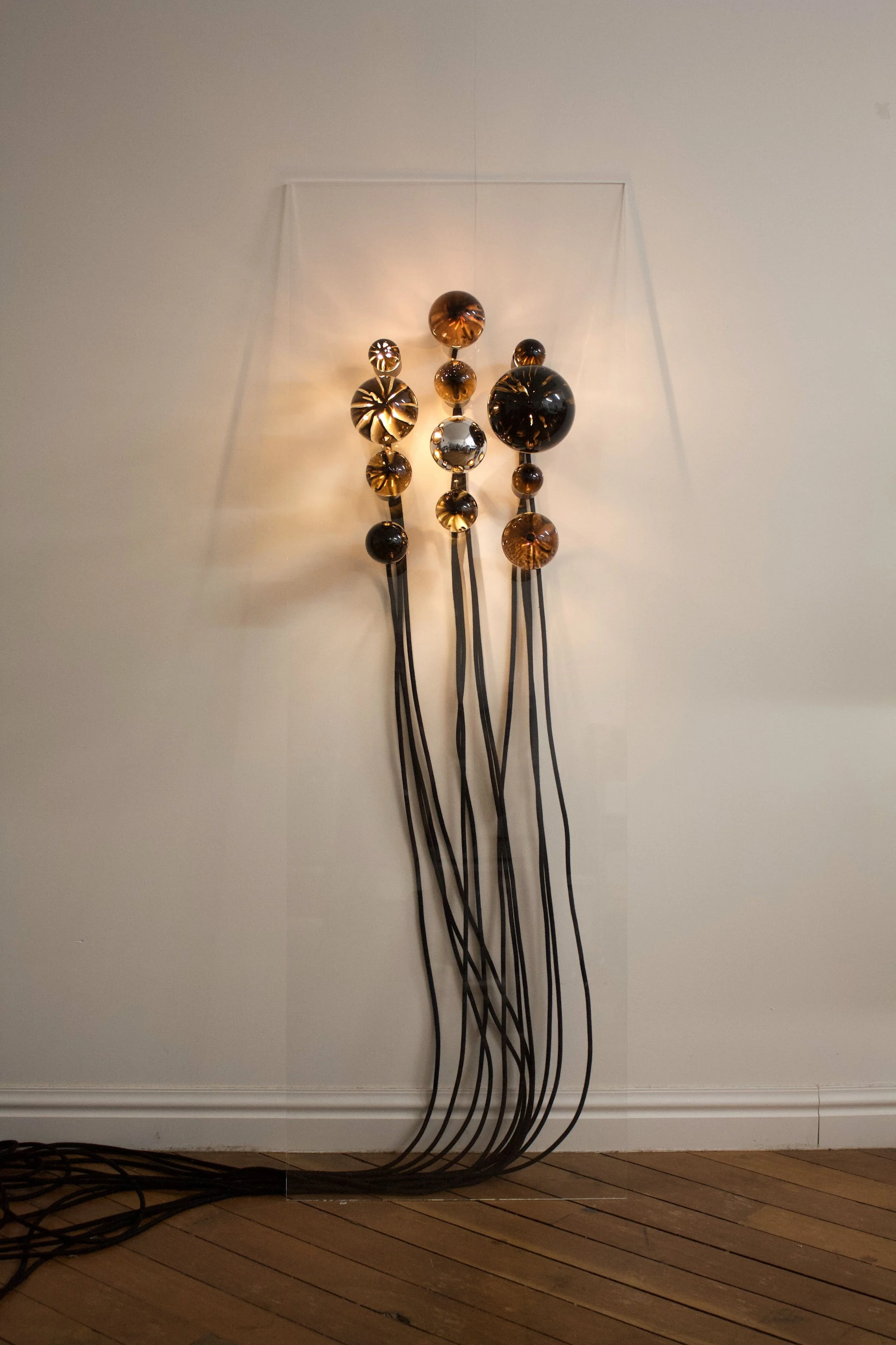 TINT sculptural light by FARO made from repurposed painted light bulbs