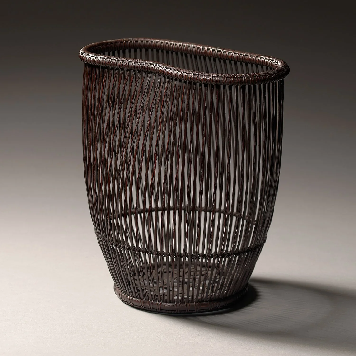 A finely woven bamboo flower basket by Shiotsuki Juran, Japan, Showa period, 1970s