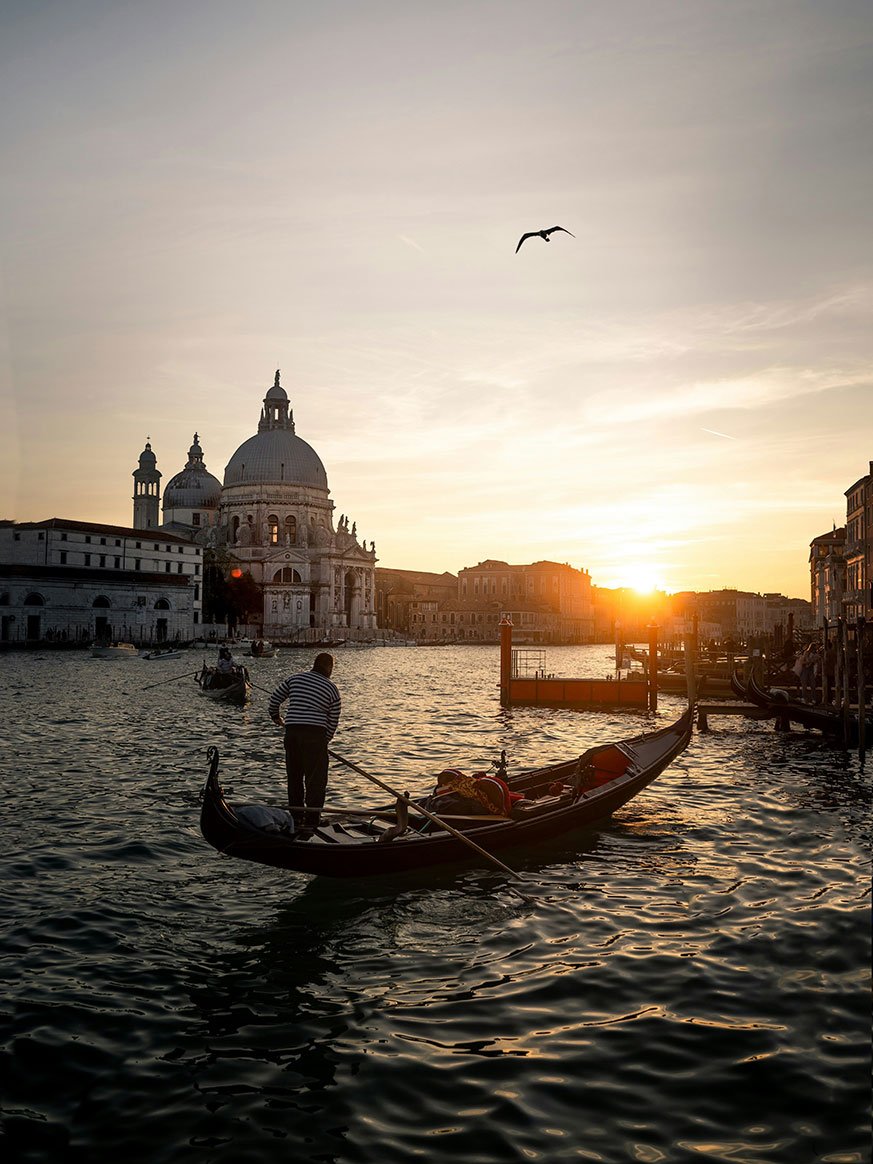 Sunset view of Santa Maria della Salute church over the Grand Canal in Venice