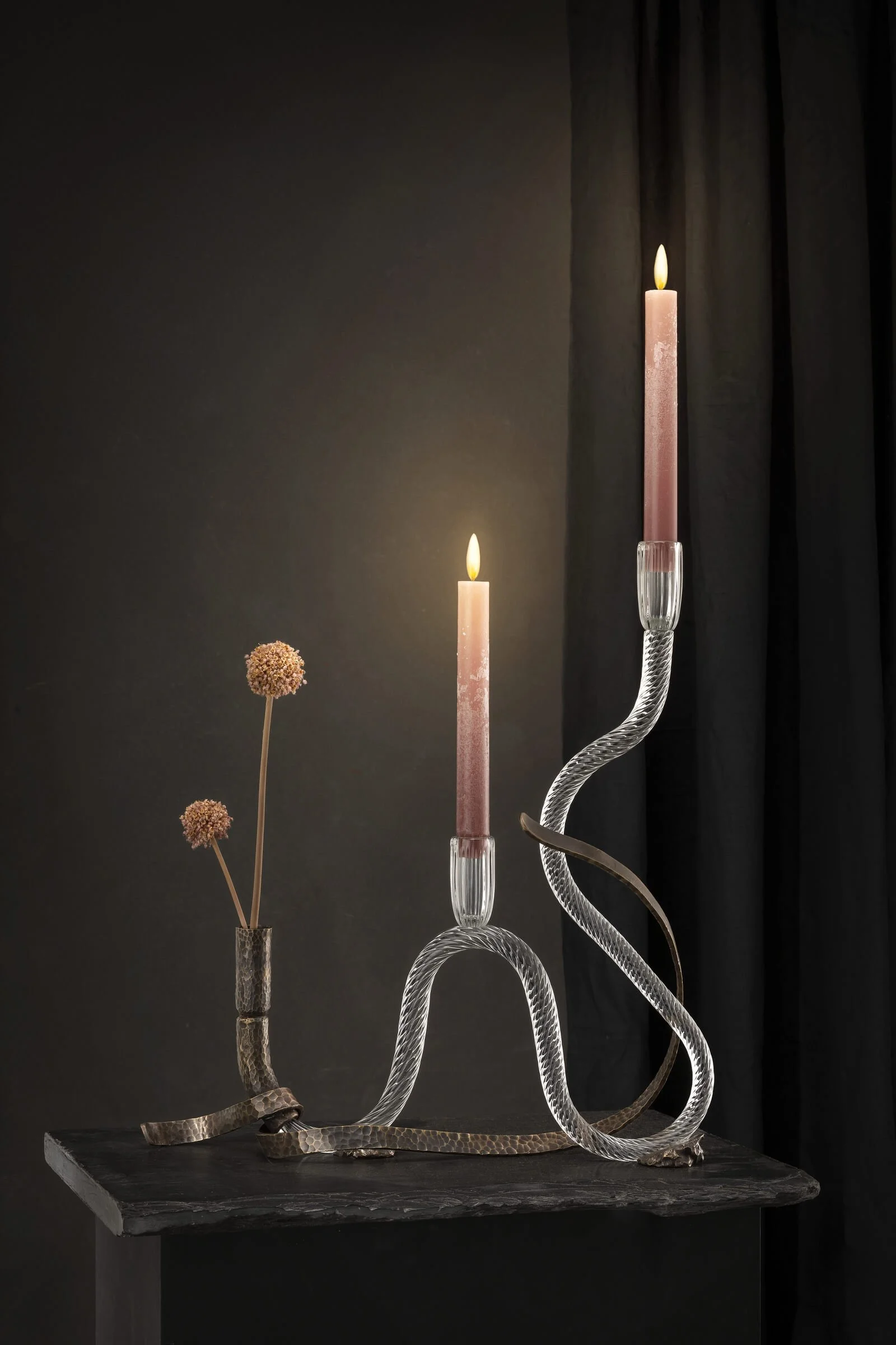 Hand poured design candle by Aina Kari with sculptural glass vessel