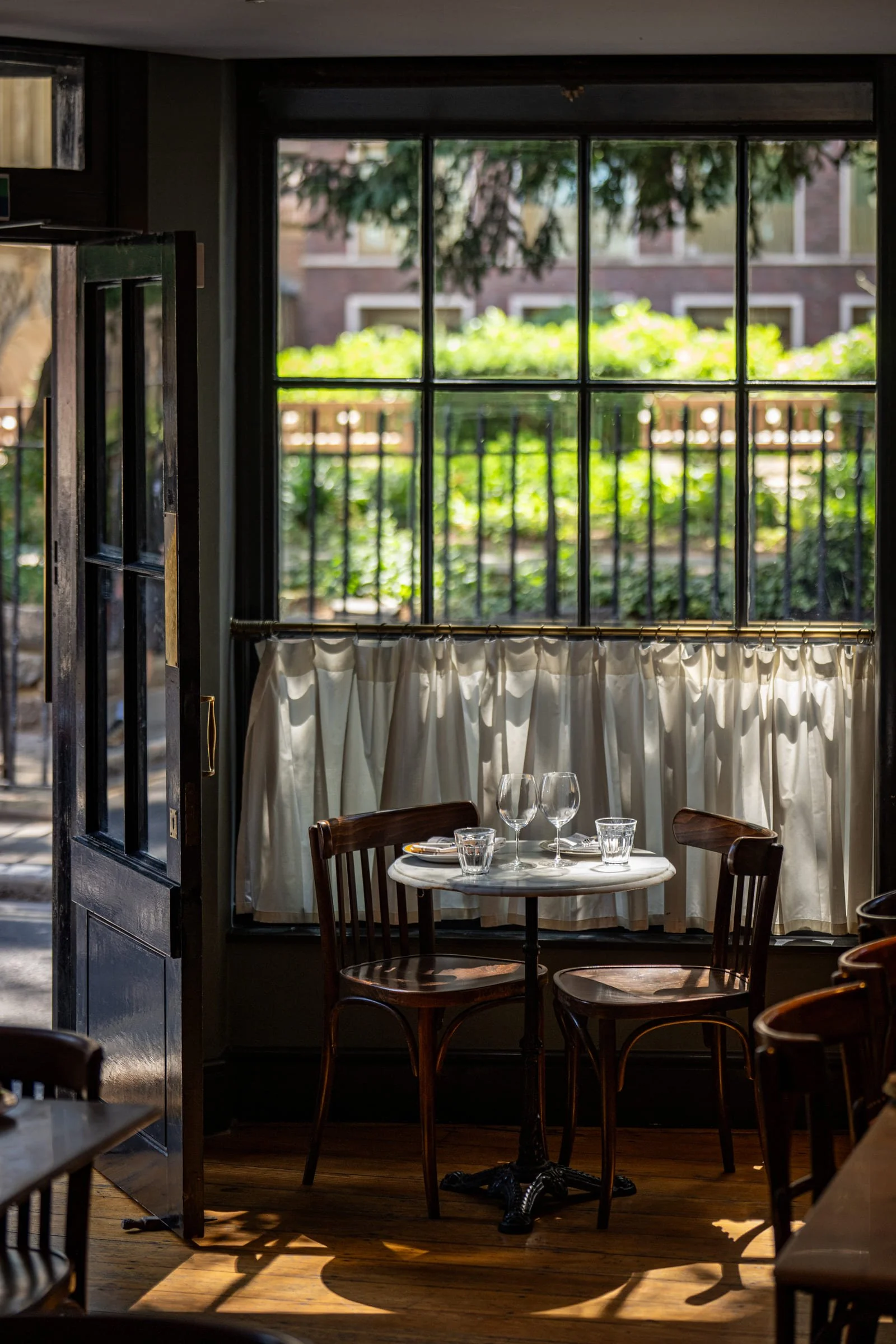 Understated materials and low light set a quietly confident tone in The Cloth's dining room