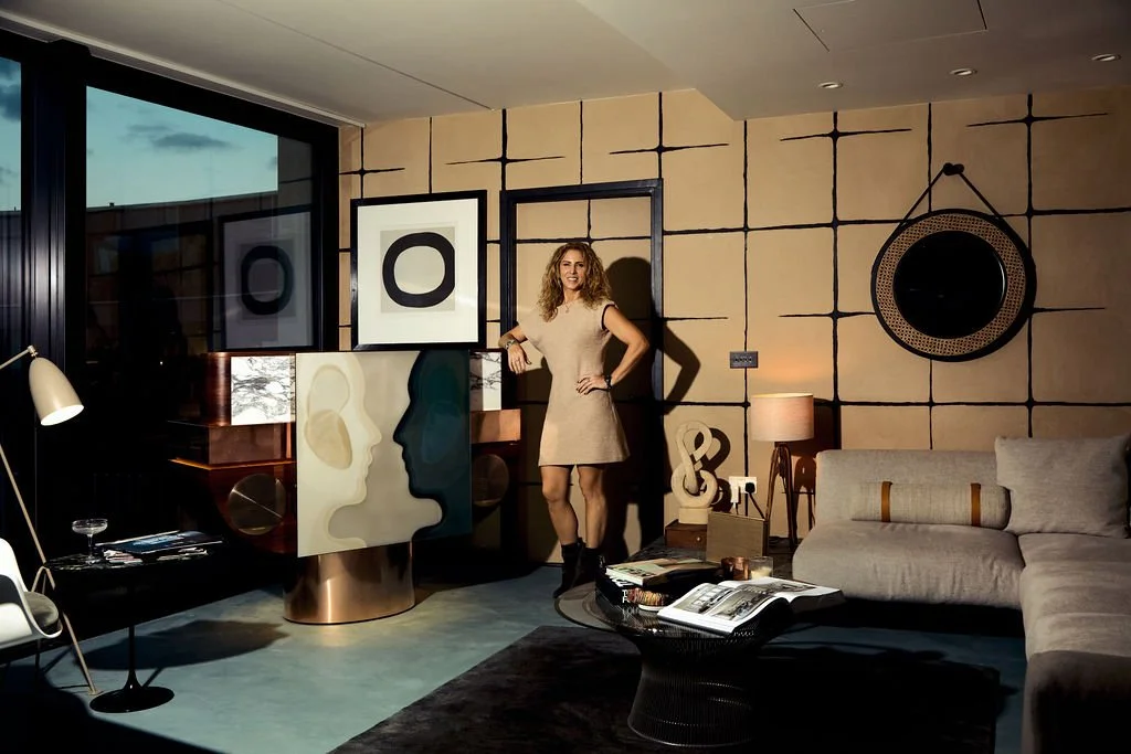 Carly Madhvani with the Club Kiva luxury DJ console in a residential interior