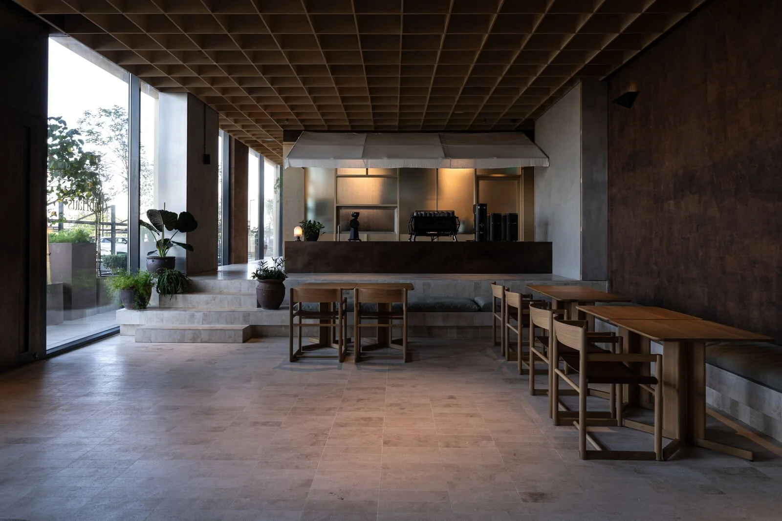 Minimalist café interior designed by shell+core with textured materials