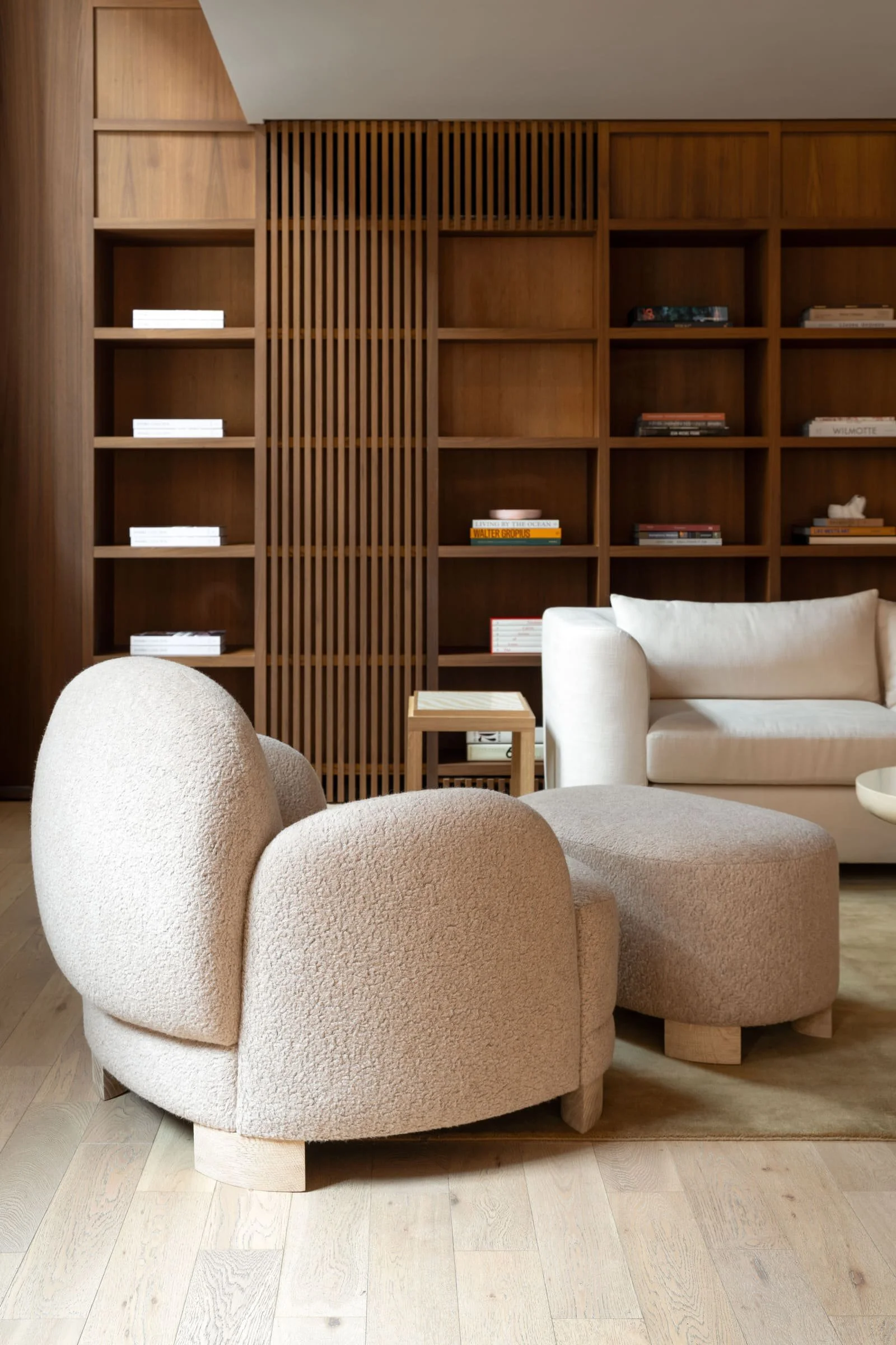 Furniture is arranged like a considered room set rather than stock inside The Invisible Collection