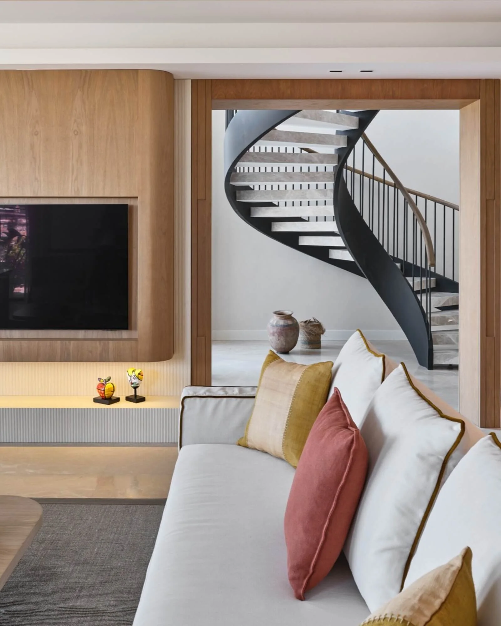 Minimal living space designed by 21A Interiors with soft lighting