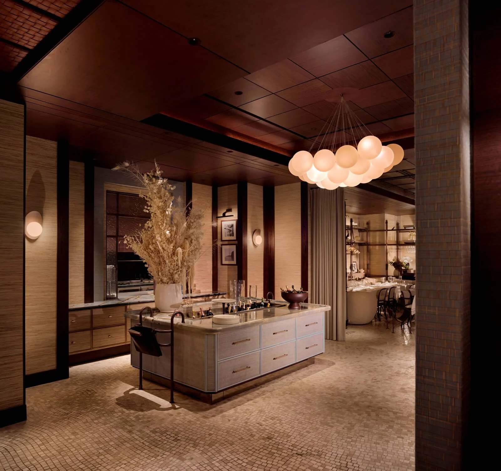 Restaurant bar area with layered lighting and textures