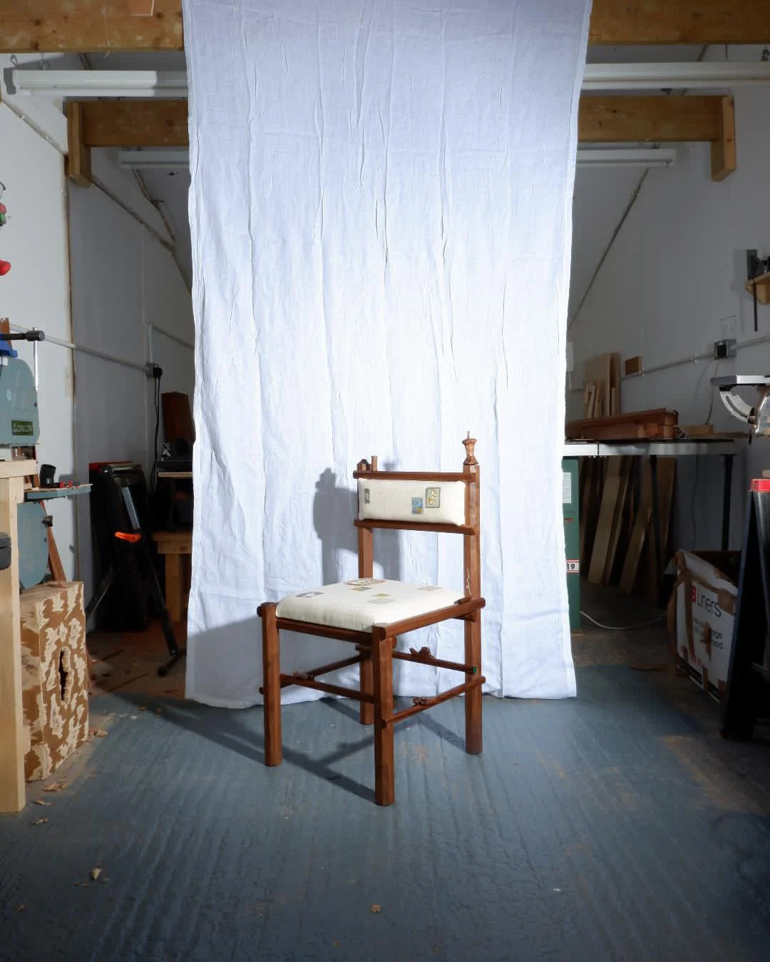 The Charming Chair in walnut by Josh Page Studio with embroidered details