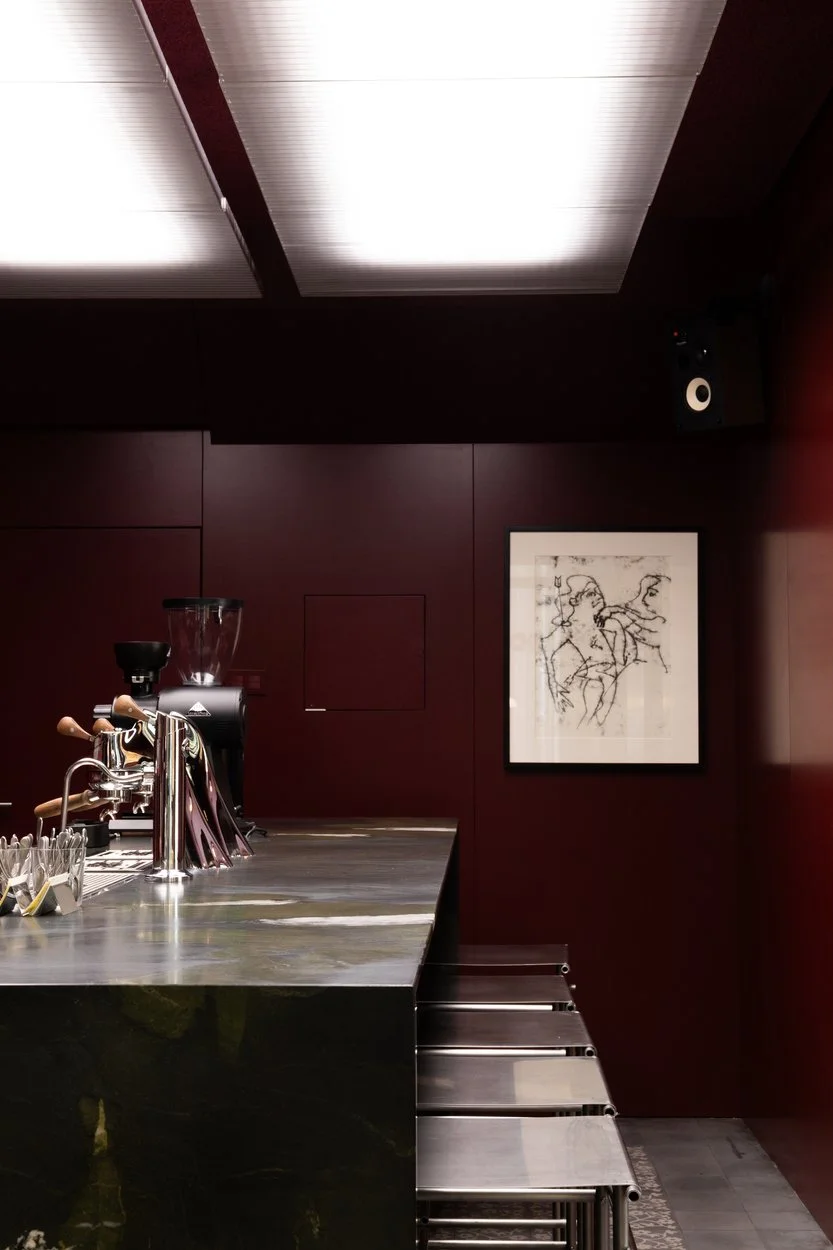 Industrial café design with refined material palette