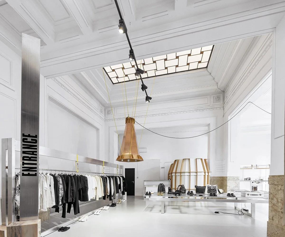 ENTRANCE fashion boutique with minimalist racks and curated clothing selection