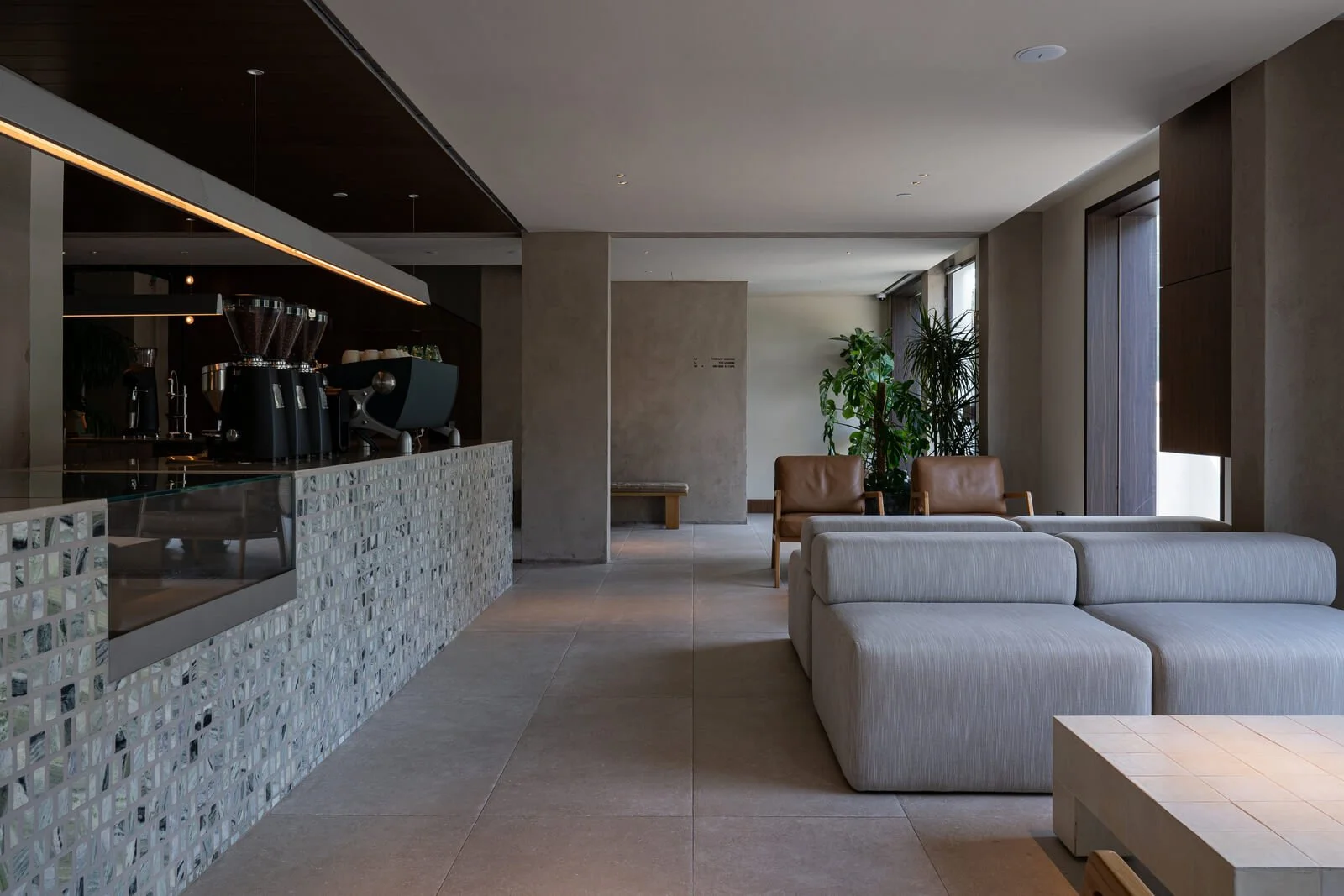 Minimalist café interior designed by shell+core with textured materials