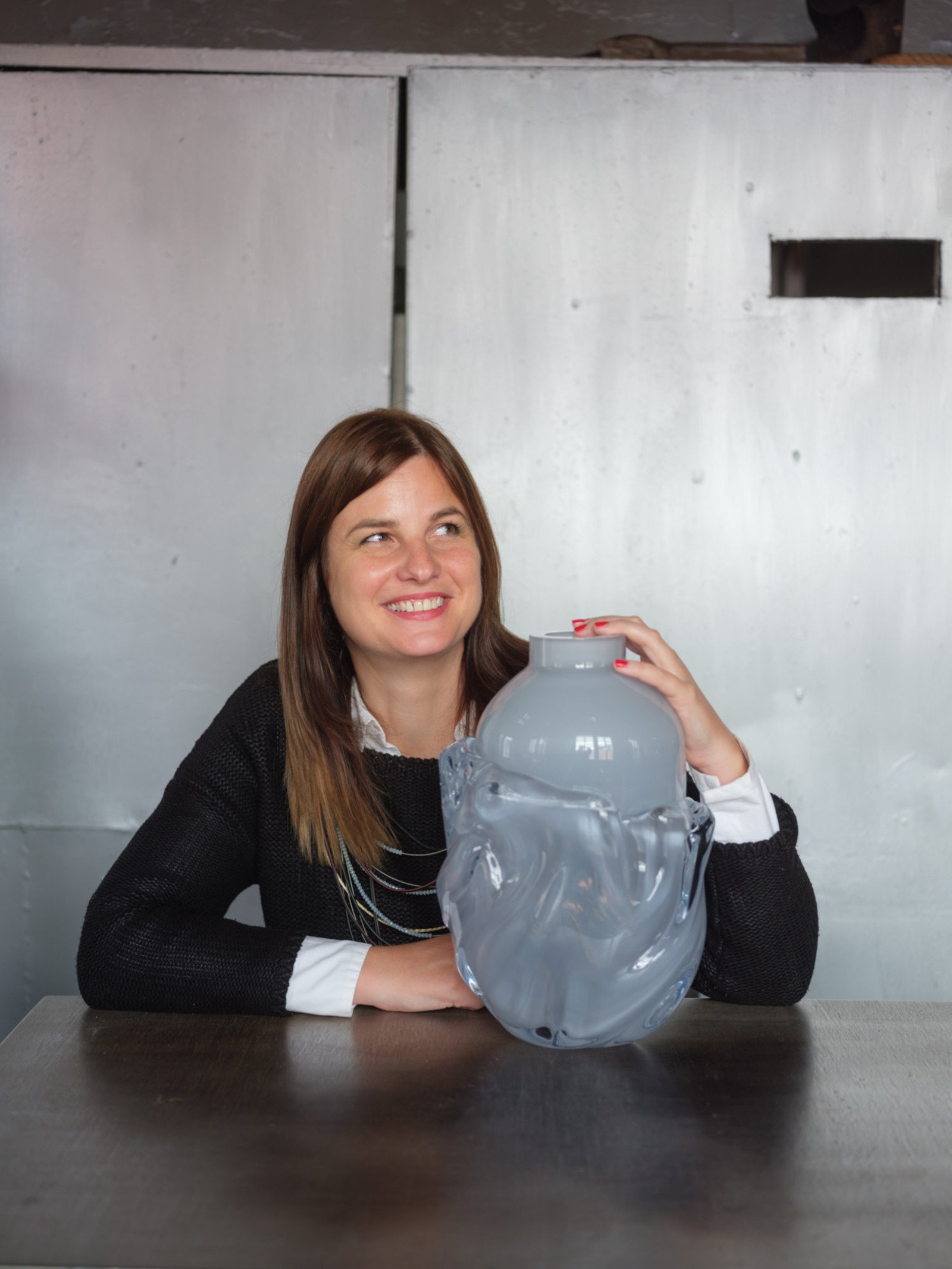 Mila Zila with her experimental glass form object with deformed rim detail
