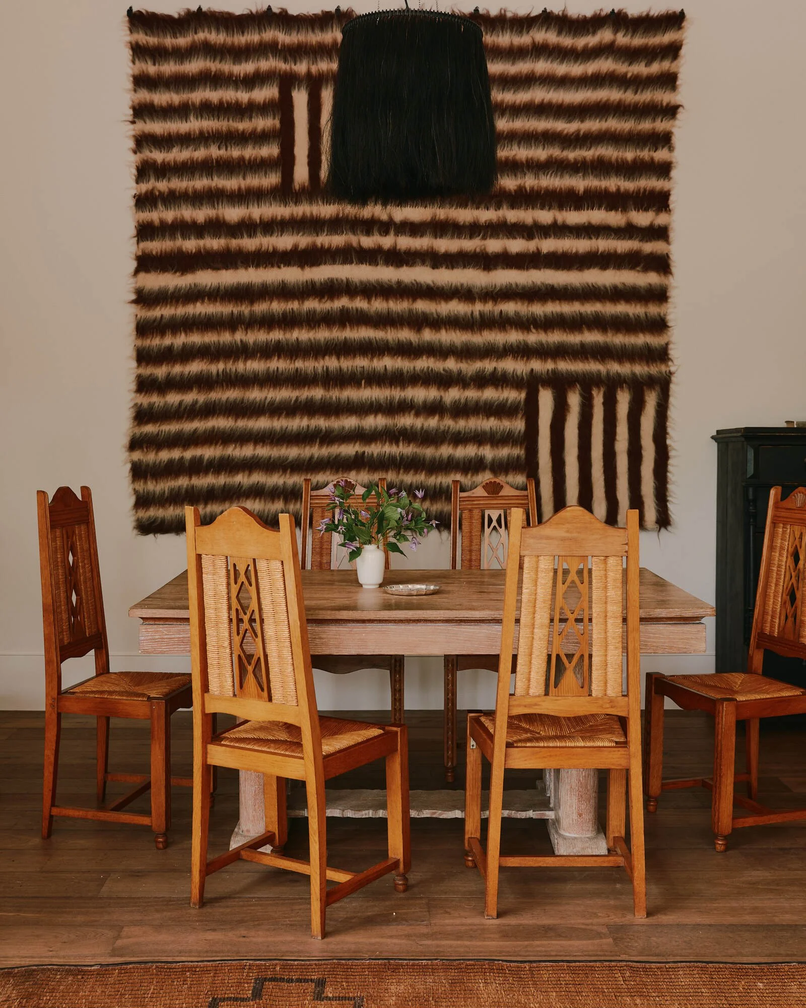 KARA MANN studio interior with material samples, furniture and design plans