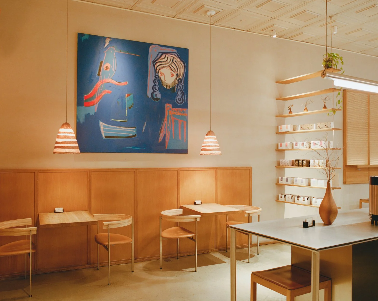 Light-filled café space with neutral palette and open layout