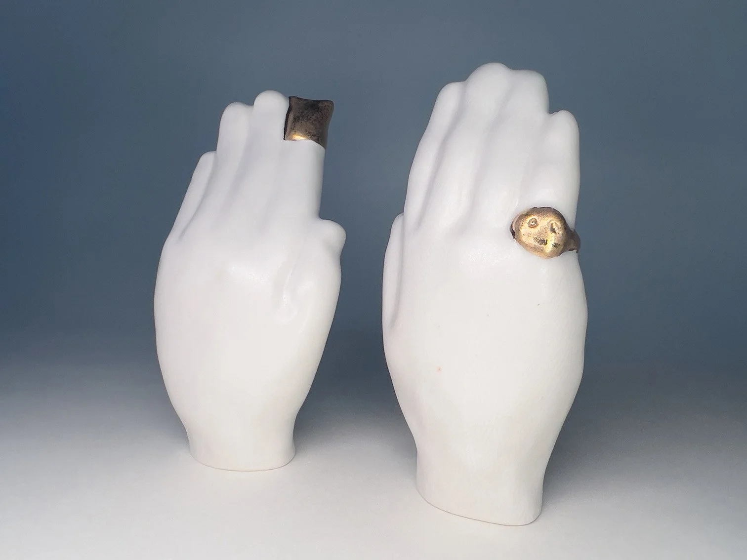 messengers--slipcast porcelain hands with gold luster details.jpg