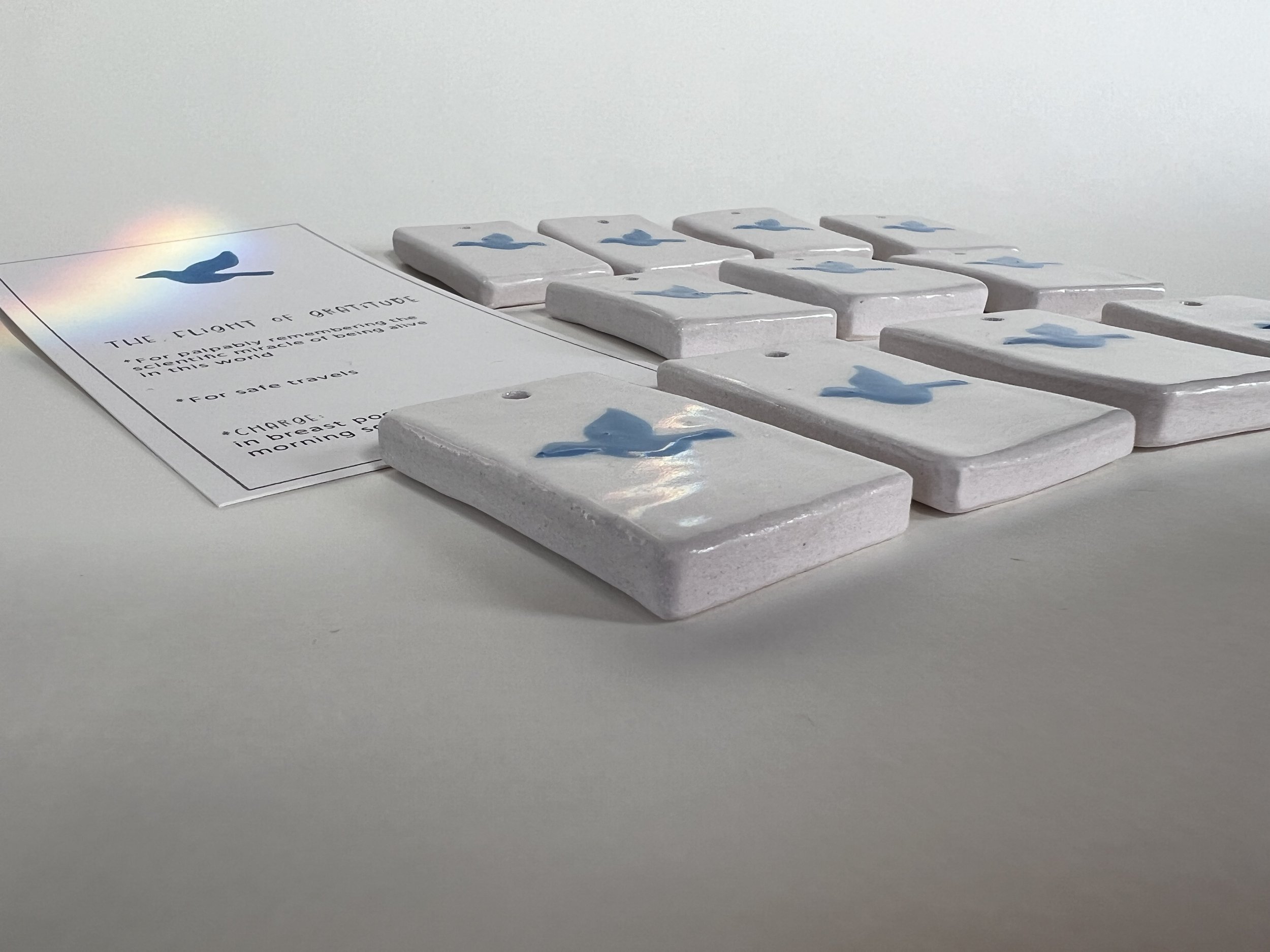 Hand painted porcelain Stormwalker guidance tile + instructional card featuring a blue bird and dedicated to The Flight of Gratitude.