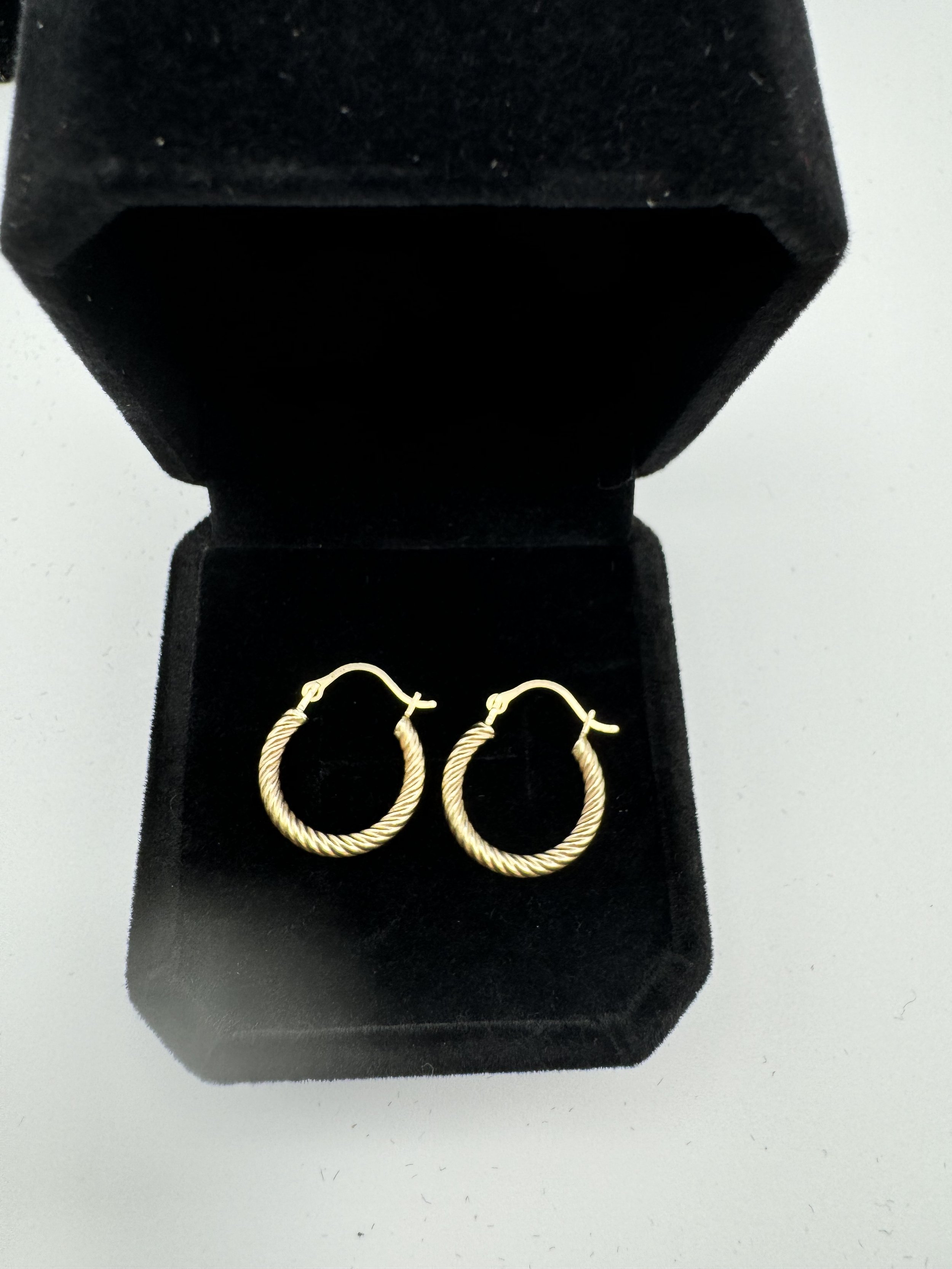 Gold small hoop earrings.