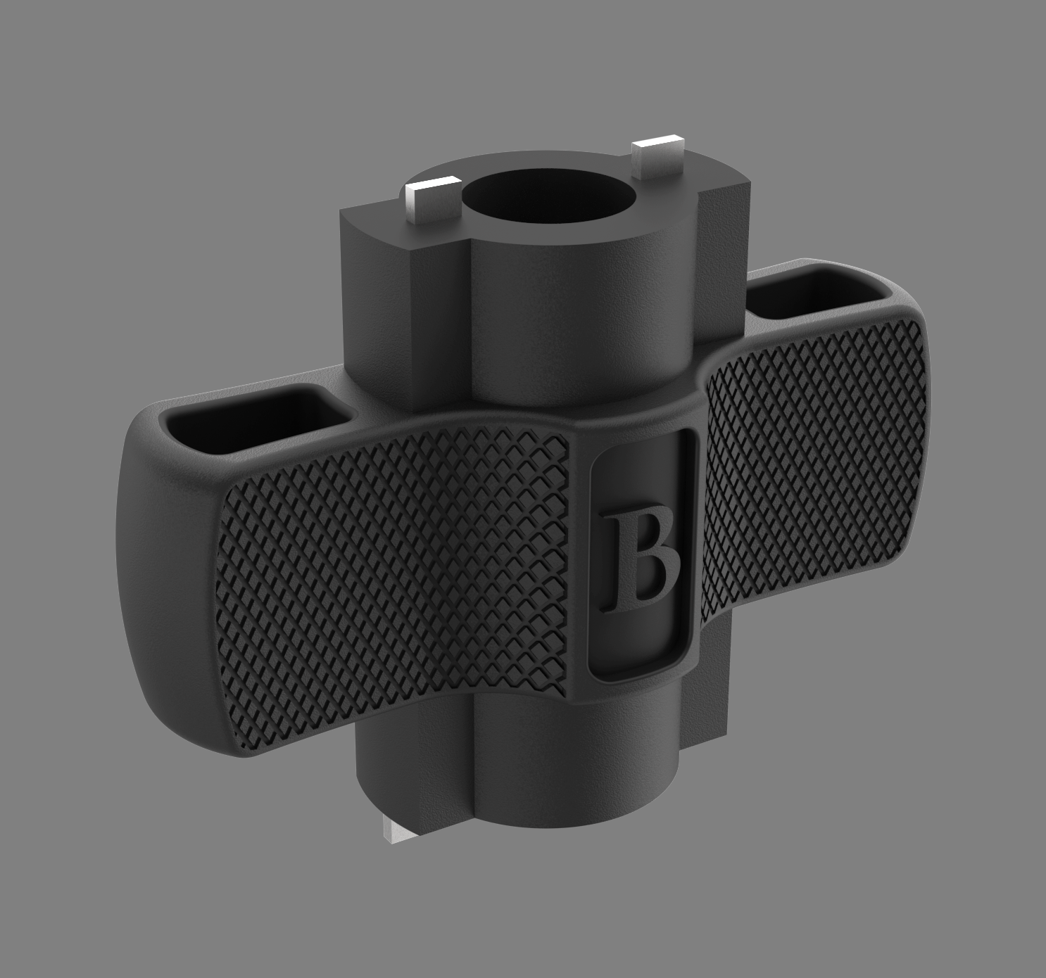 A black grip with textured handles, marked with a large letter 'B' in the center, and a mounting bracket above.
