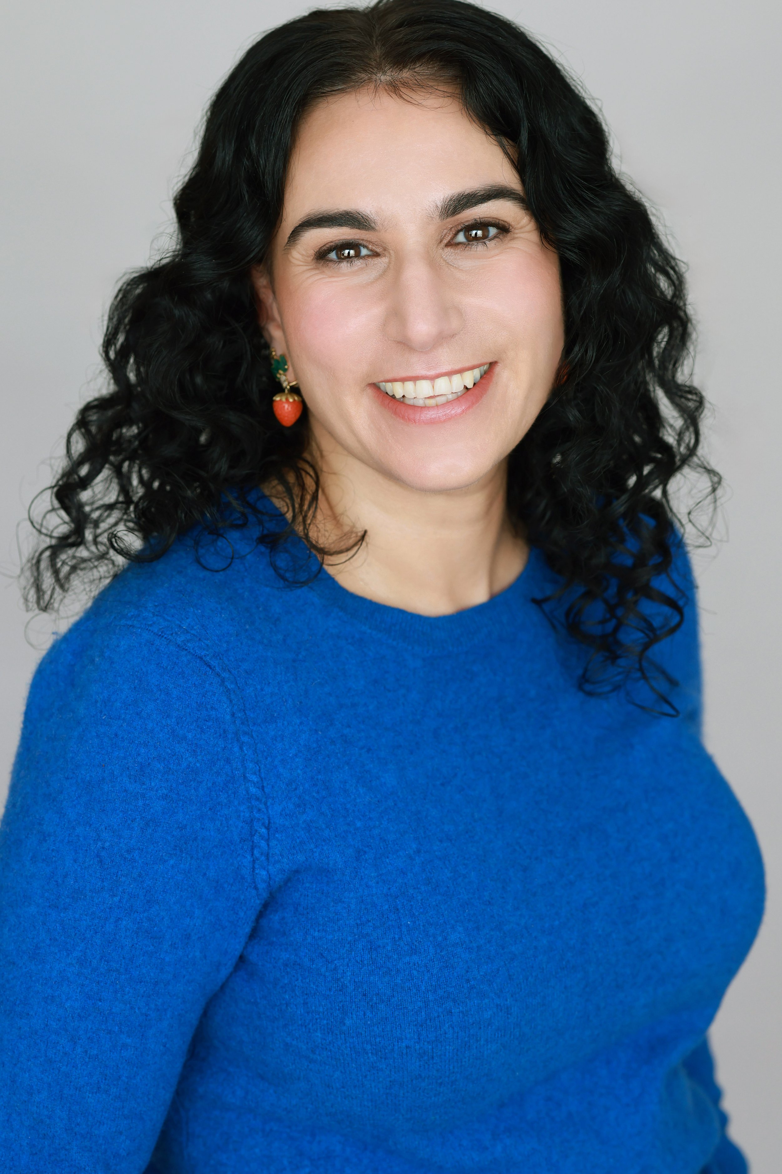 Rebekah Kouy-Ghadosh Headshot - Cerulean