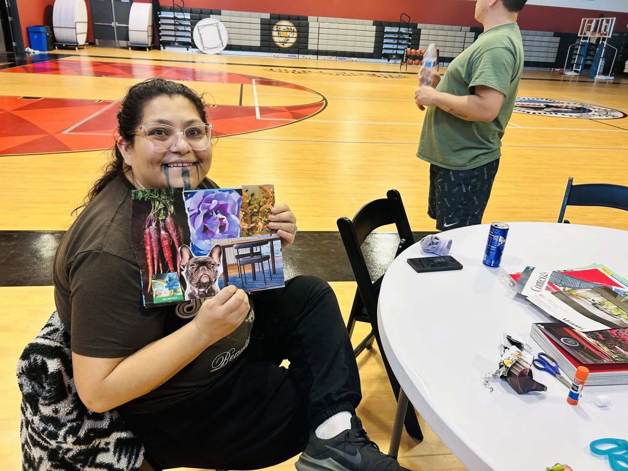 A community member poses with her collage made at the January 2026 Movement & Making gathering from DiRT & Glitter in Klamath, CA