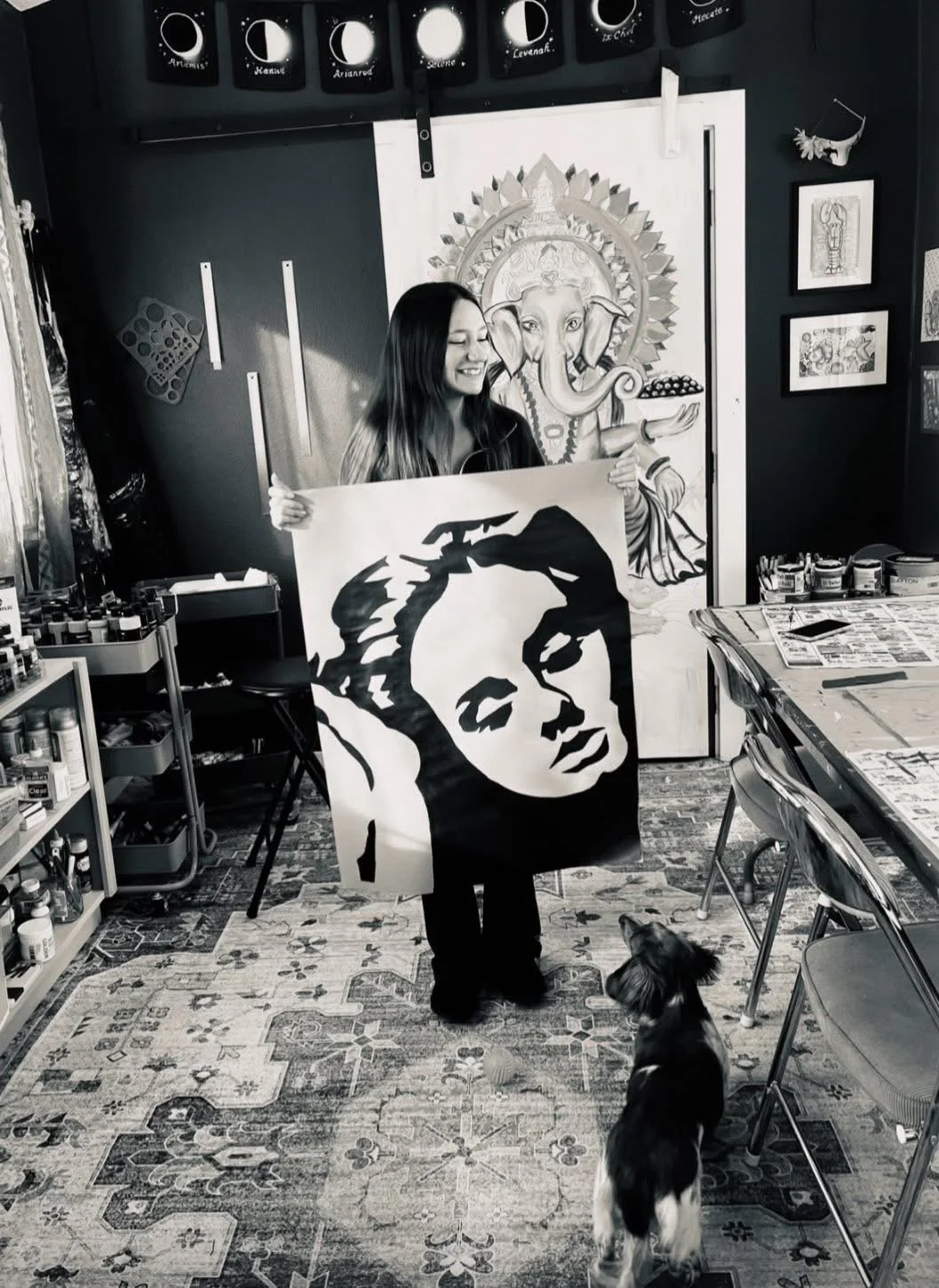 Local youth artist poses with art created during a DiRT & Glitter visual arts class with Jessica Cherry in Del Norte County, CA