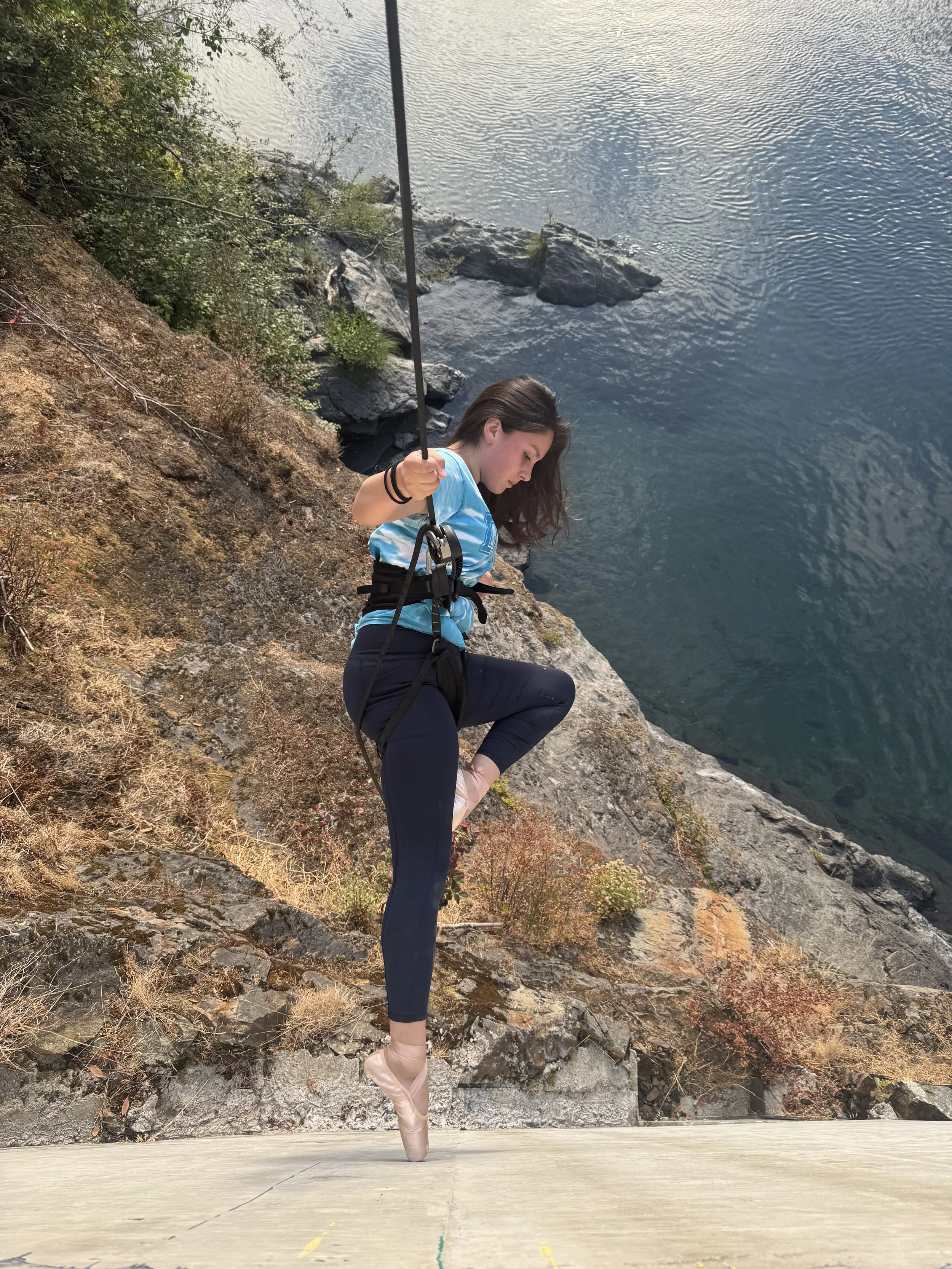 Dirt & Glitter youth performance member and Drill Dance instructor Haylee Mattz-Charles dances over the Smith River in Del Norte County