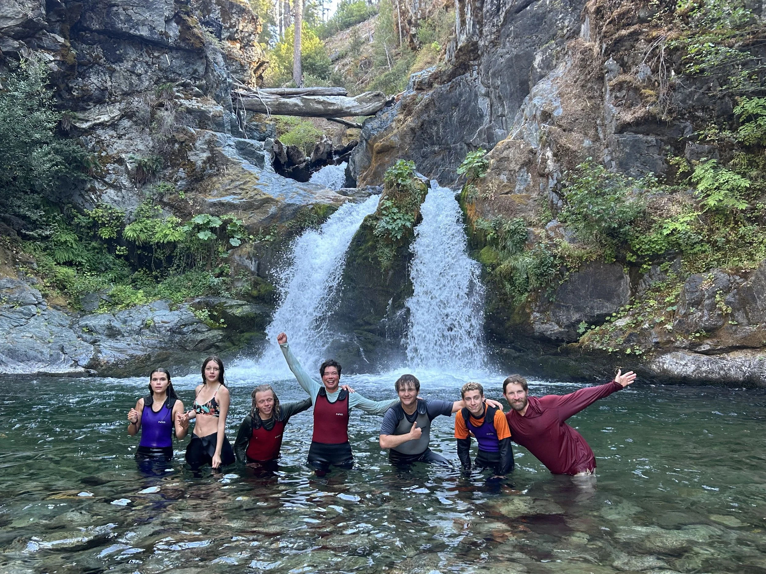 Participants in the end of summer Earth Right Adventure Camp on the Klamath river explore waterfalls on Ukonom Creek