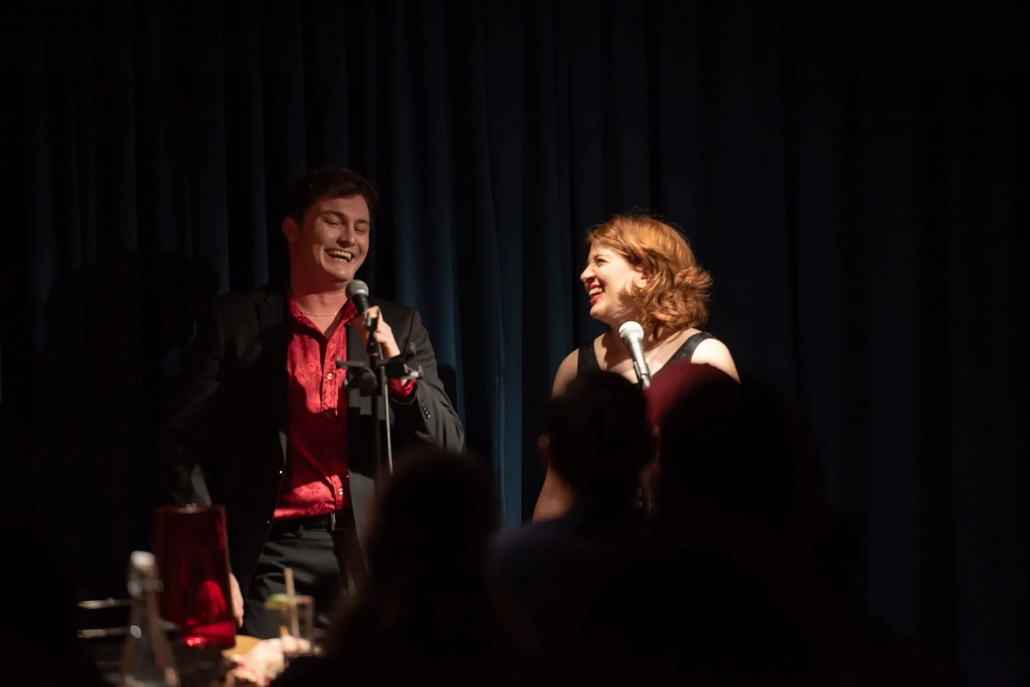 A performance photo from Chameleon Theater Collective's Valentine's Cabaret. Song: "Dancing Through Life" (Wicked)