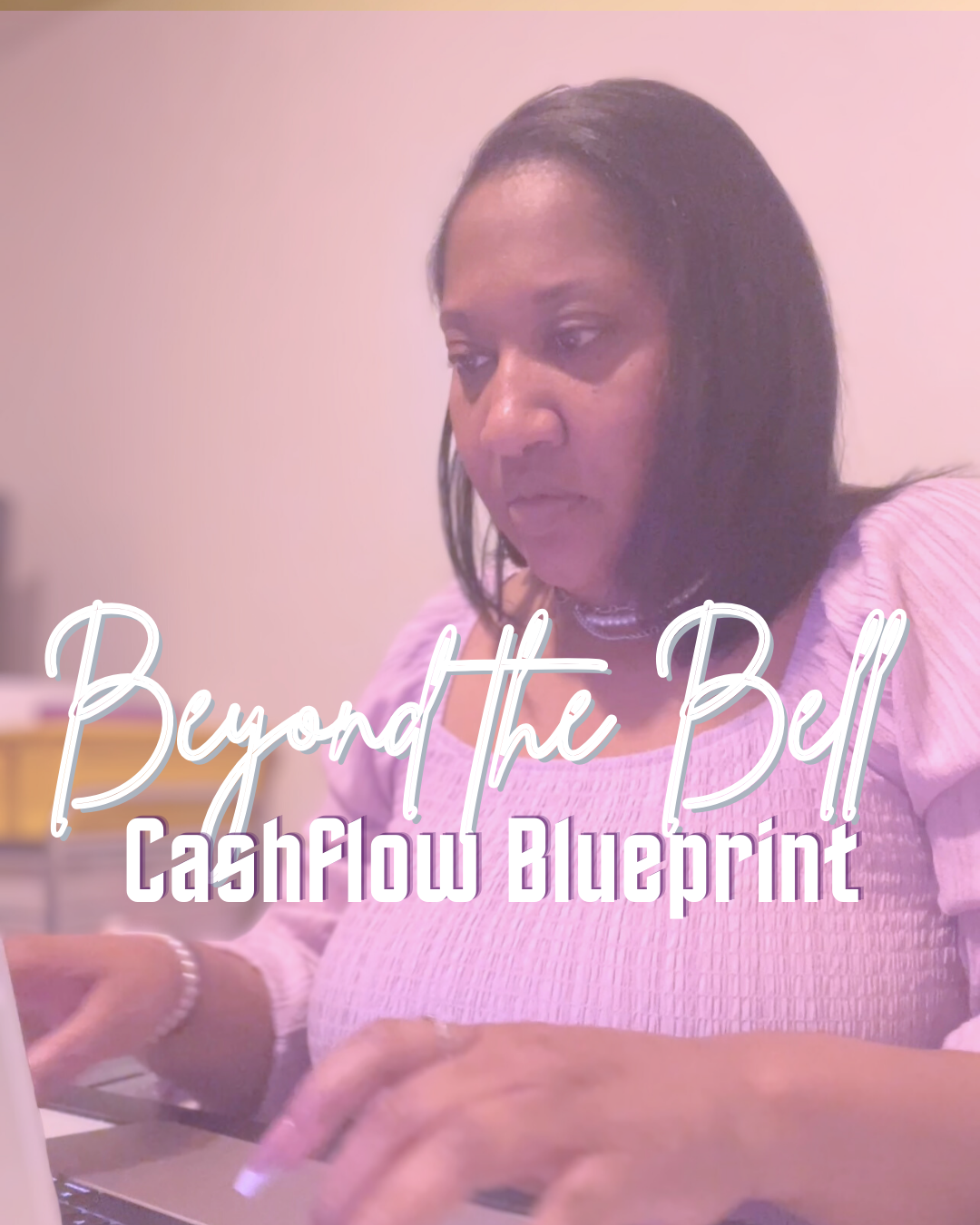 Woman in a purple shirt, sitting in front of a computer typing