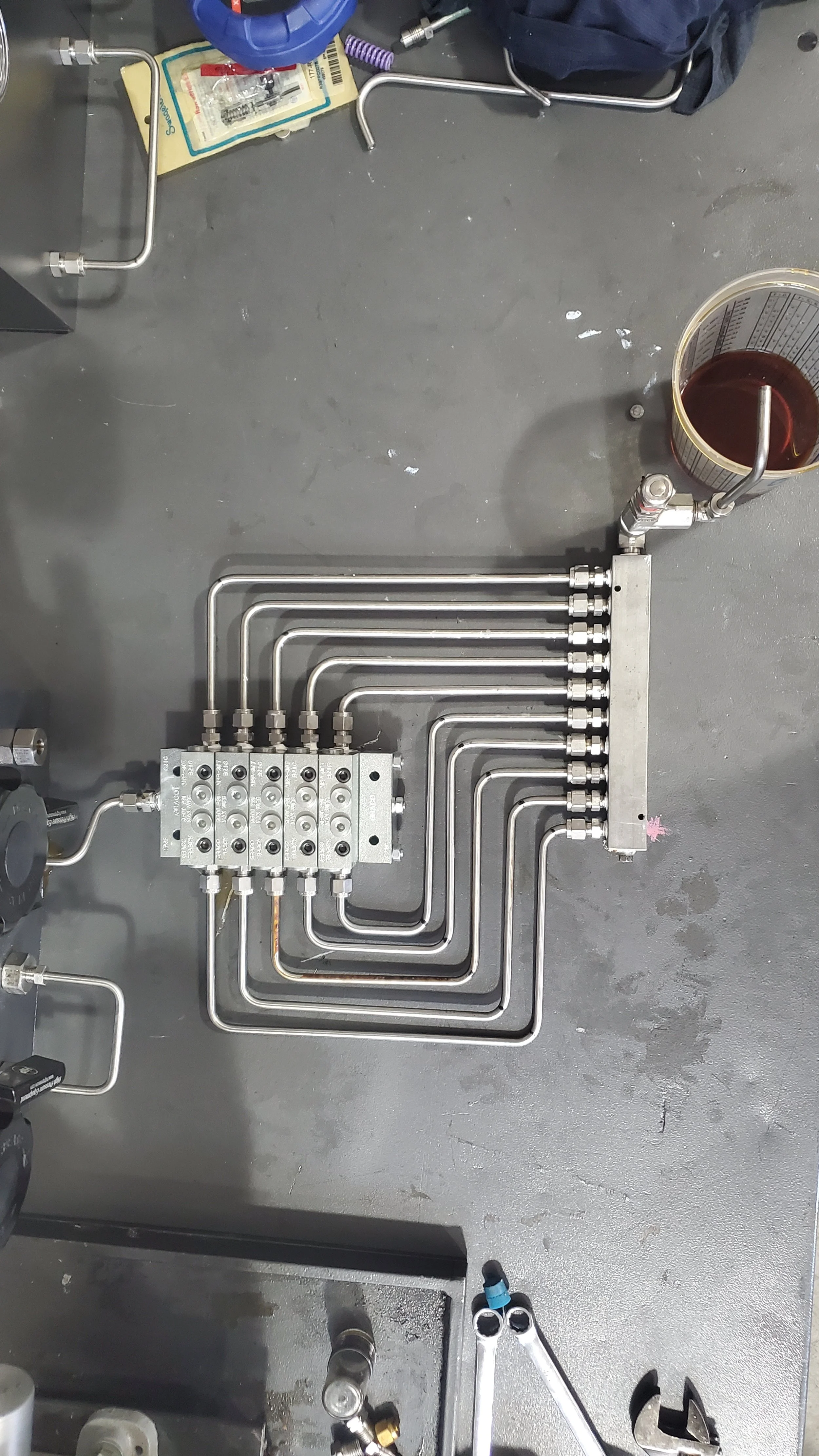 Testing flow through lubrication divider valves